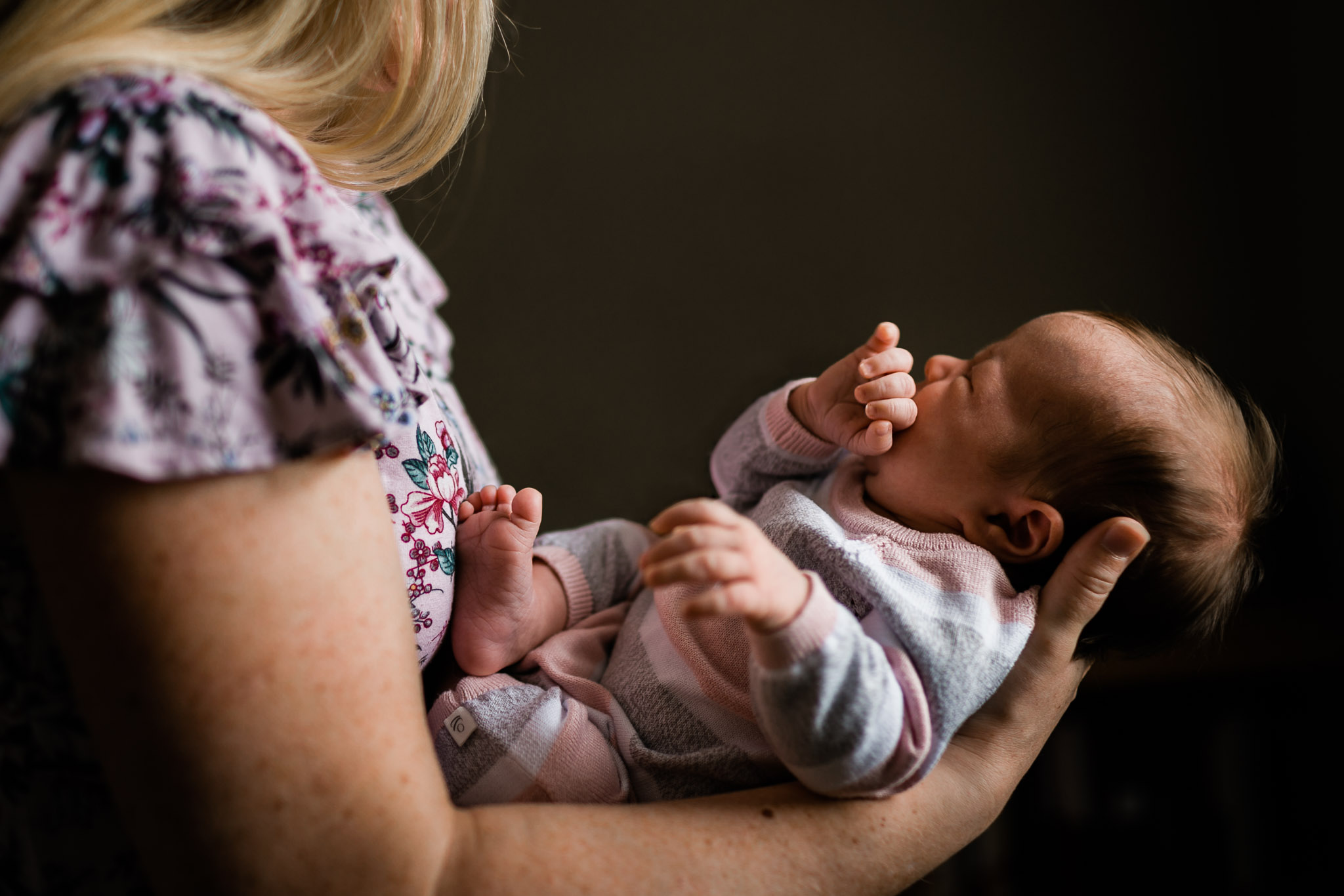 Mother holding baby girl with dramatic shadows | Newborn Photographer in Durham | By G. Lin Photography