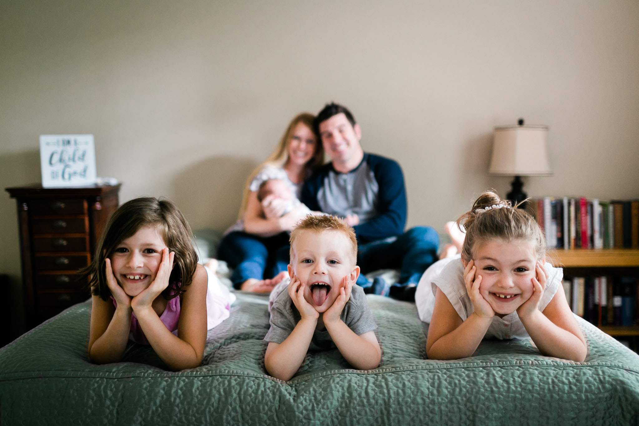 Cute sibling photo of kids on bed | By G. Lin Photography | Durham Family Photographer