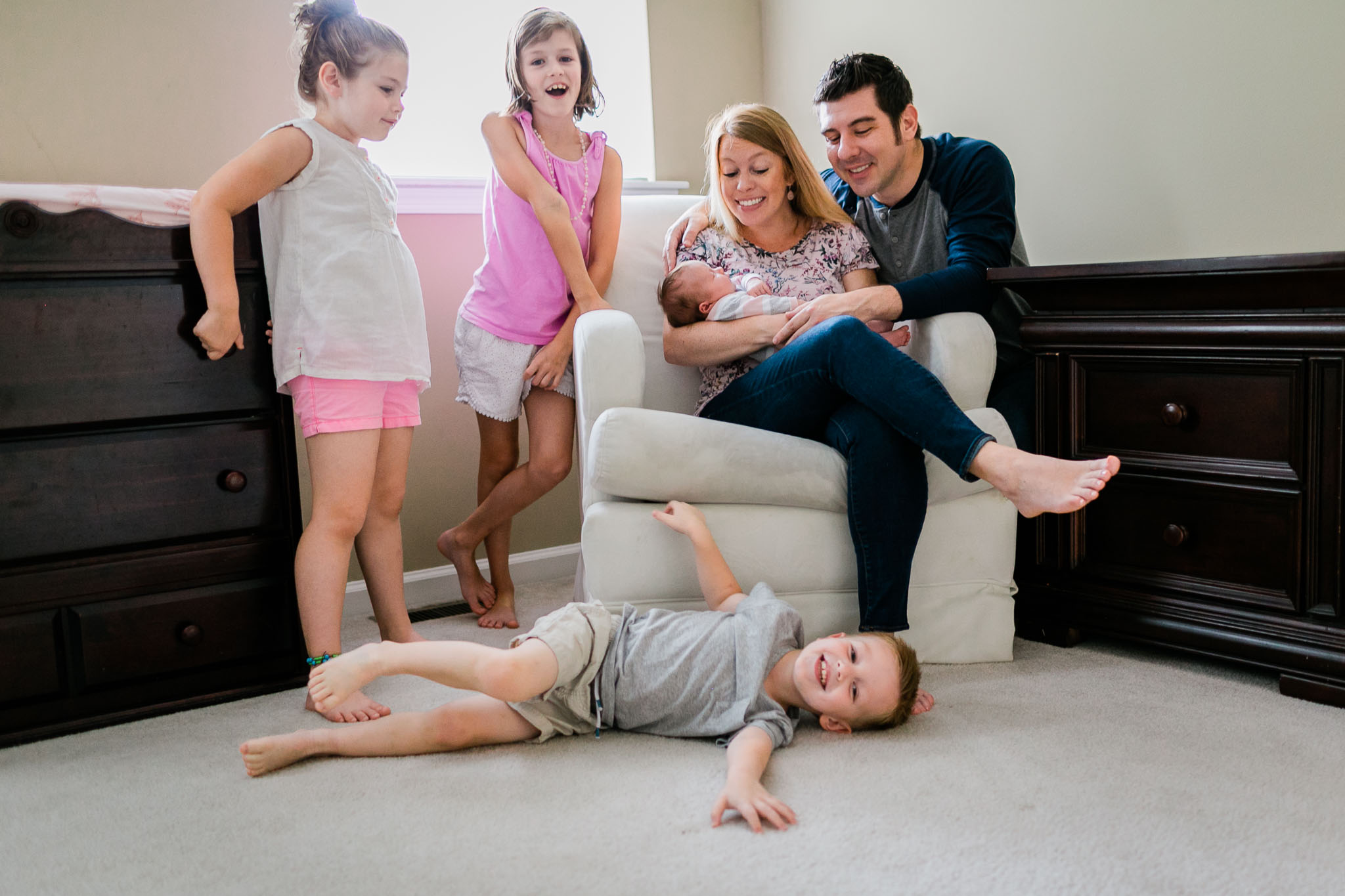 Raleigh Newborn Photography | By G. Lin Photography | Boy playing with family at home