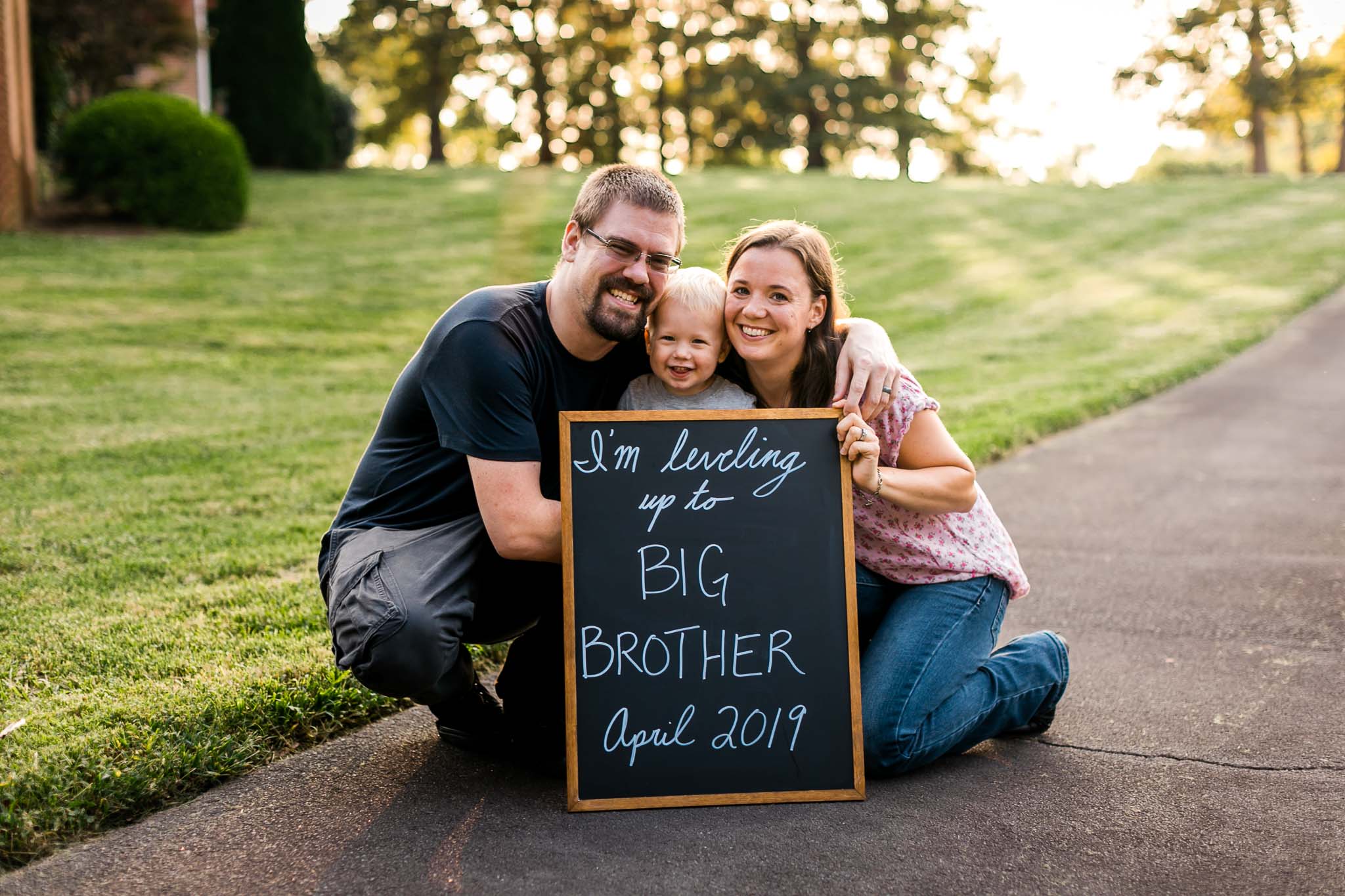 Pregnancy announcement with family and chalkboard | Gamer Dad | By G. Lin Photography | Rougemont Family Photographer