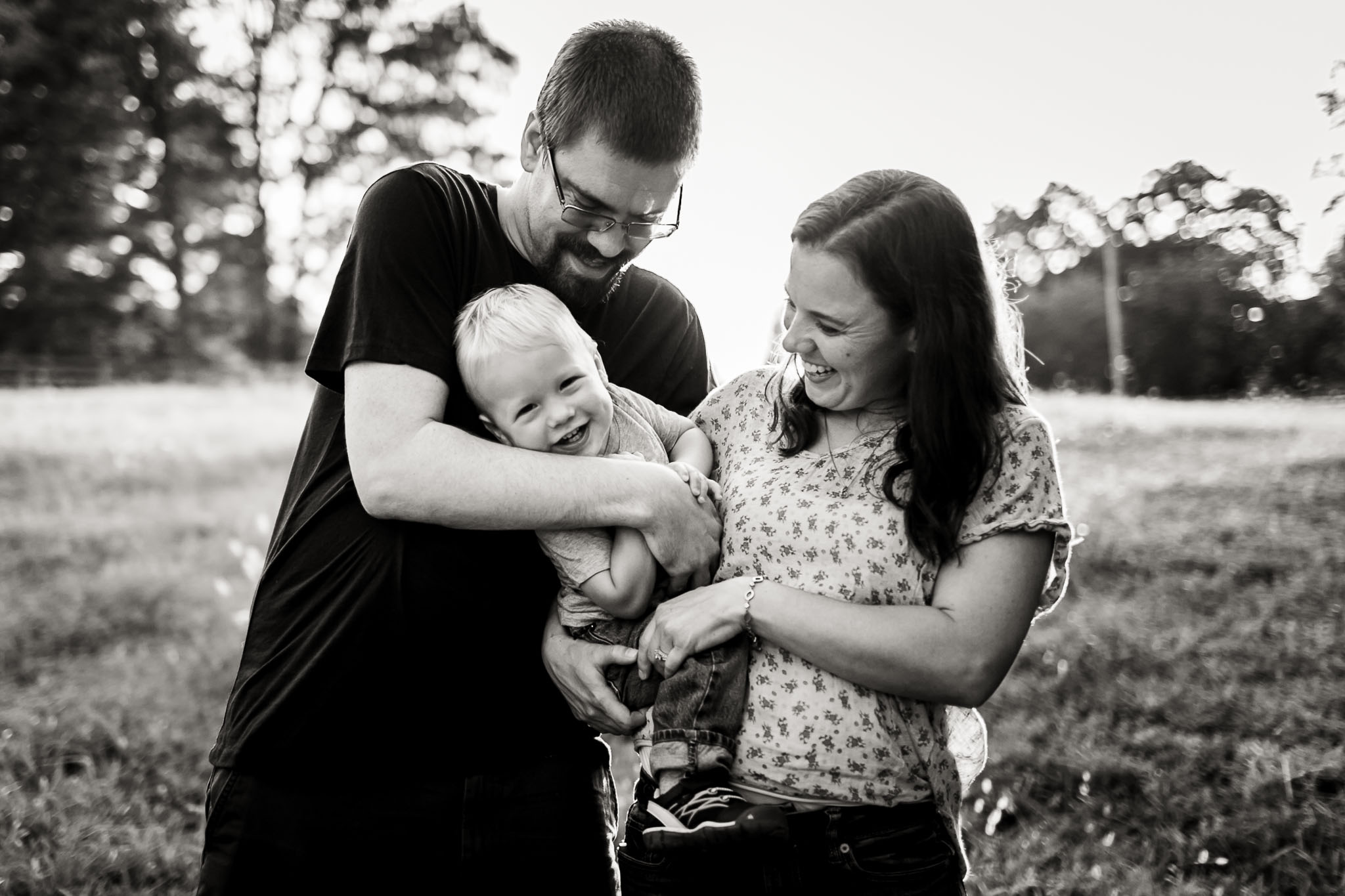 Cute black and white photo of family outdoors | By G. Lin Photography | Durham Family Photography