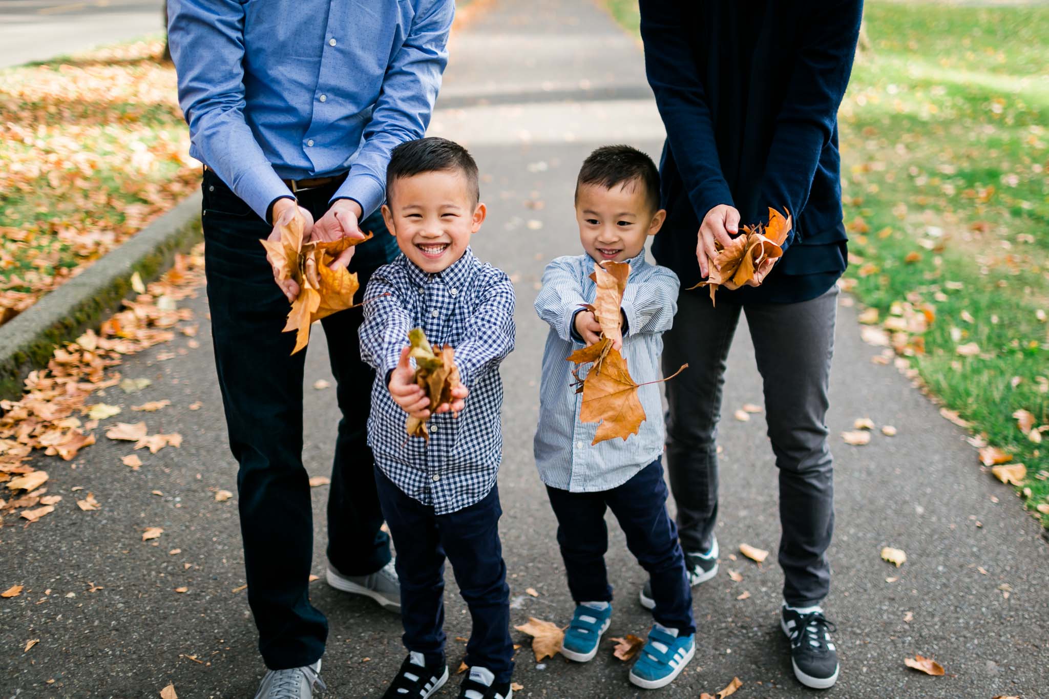 Boys holding leaves | Seattle Family Photographer | By G. Lin Photography