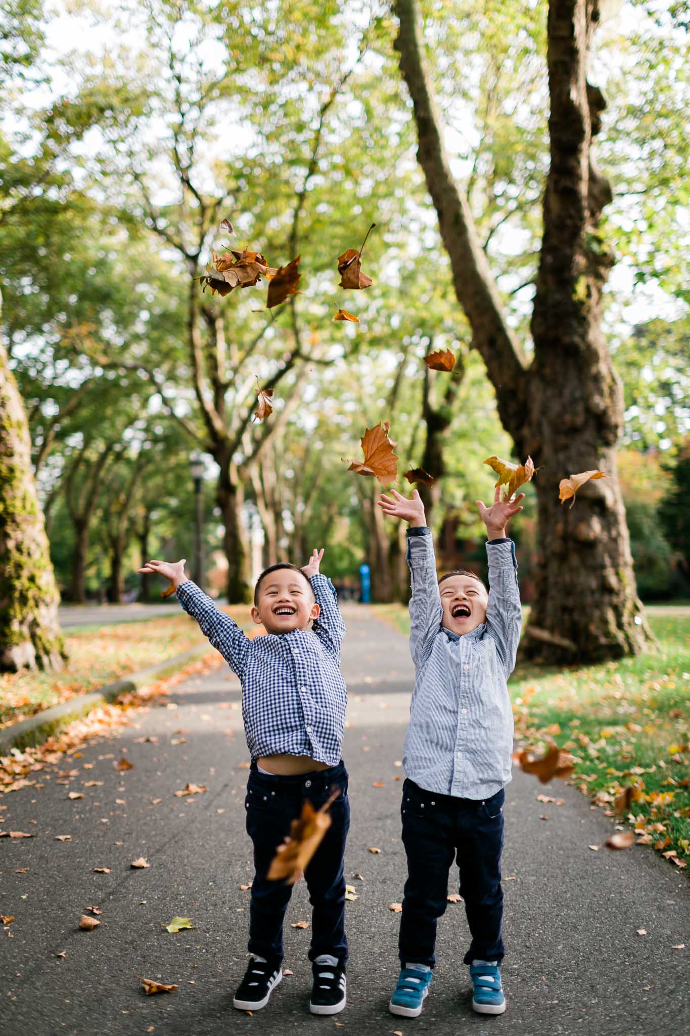 Twin boys throwing leaves in the air | Durham Family Photographer | By G. Lin Photography