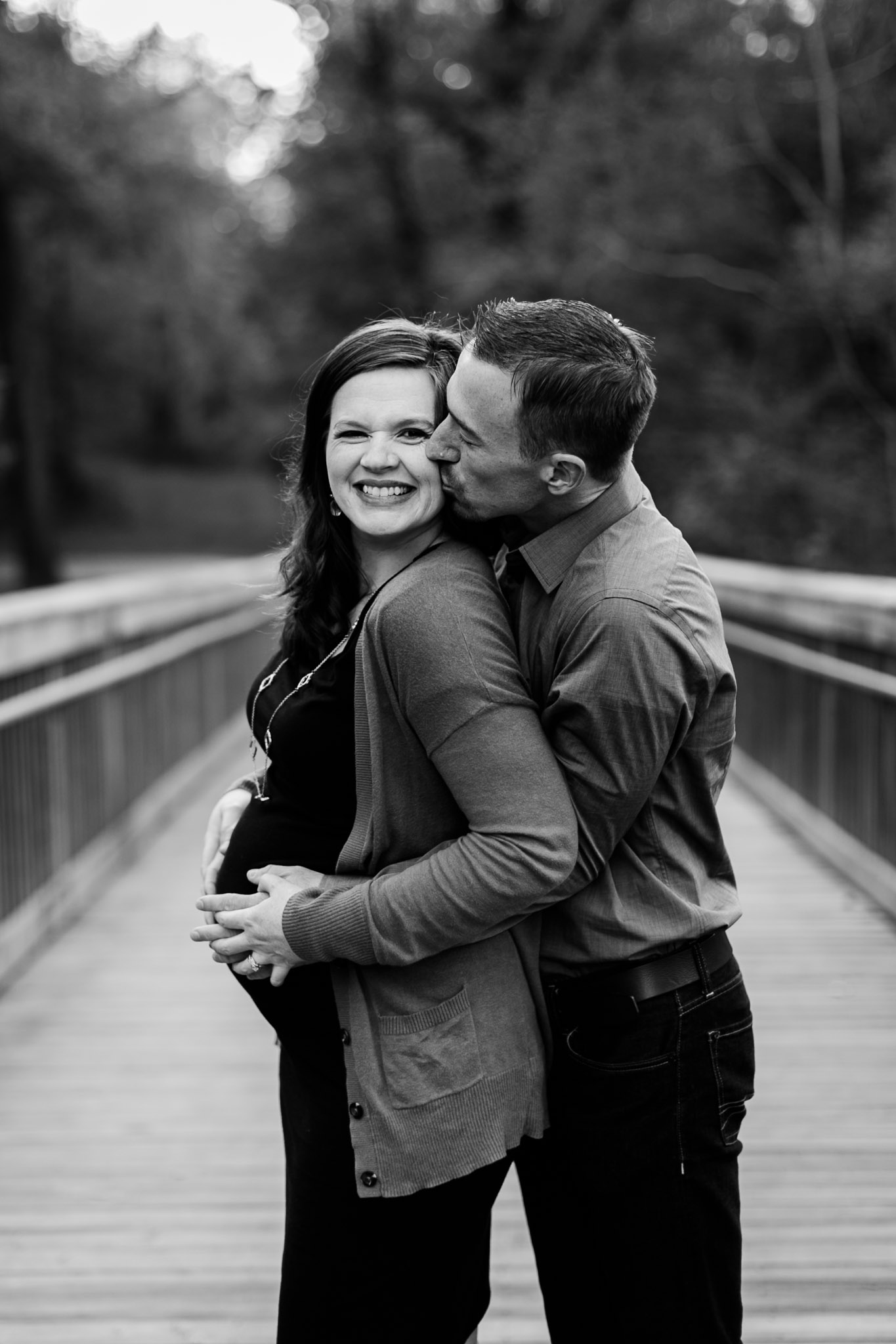 Cute black and white maternity photo of couple on bridge | Hillsborough Riverwalk | Durham Maternity Photographer | By G. Lin Photography