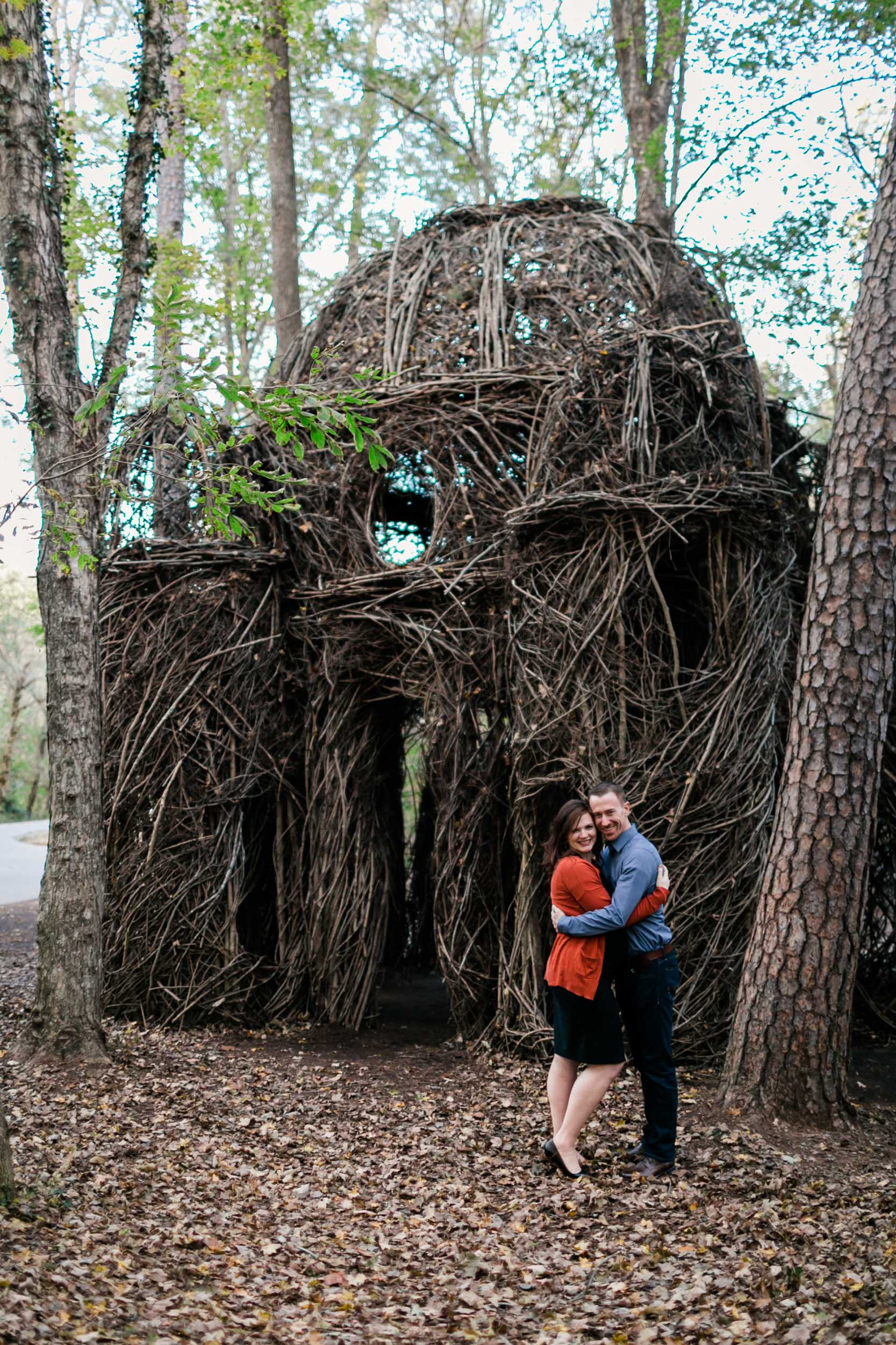Couple standing with Twig Sculpture at Hillsborough Riverwalk | Durham Maternity Photographer | By G. Lin Photography 