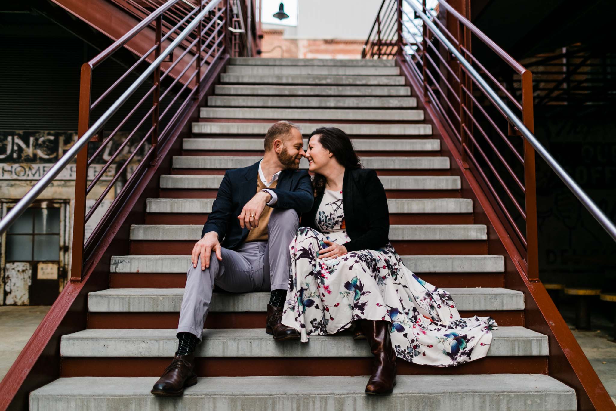 Couple sitting on steps at American Tobacco Campus | Durham Photographer | By G. Lin Photography