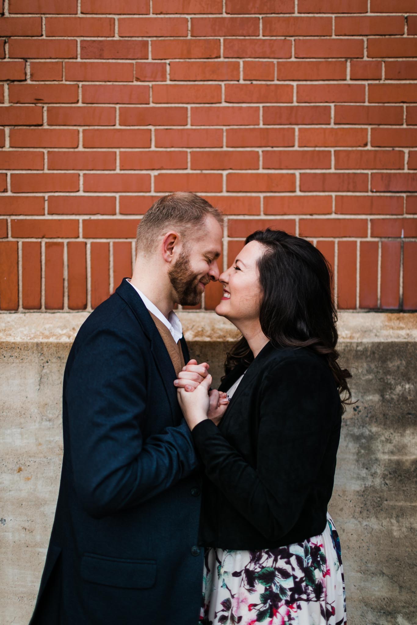 Candid shot of couple laughing at American Tobacco Campus | Durham NC Photographer | By G. Lin Photography