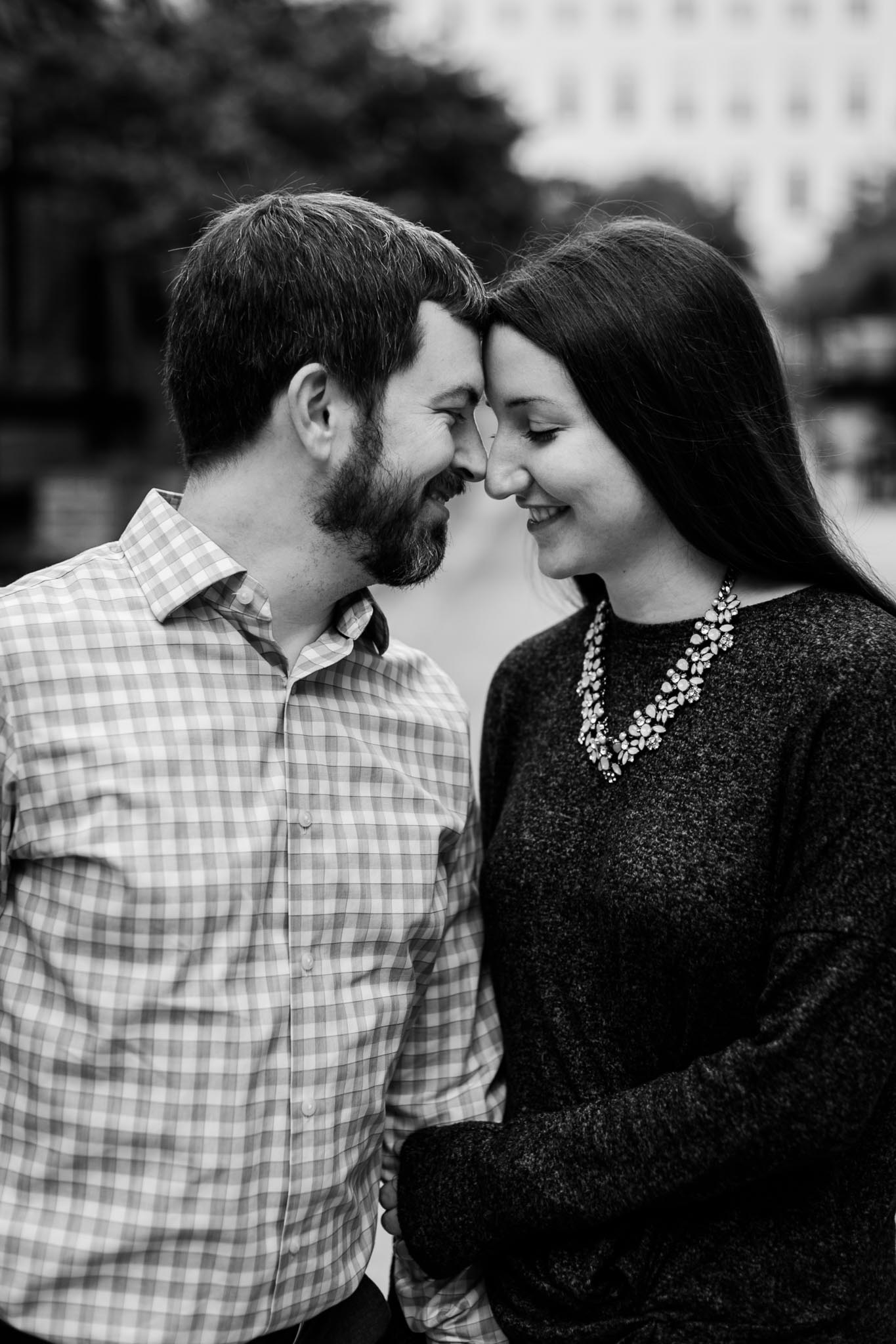 Black and white photo of couple in downtown durham | Durham Photographer | By G. Lin Photography