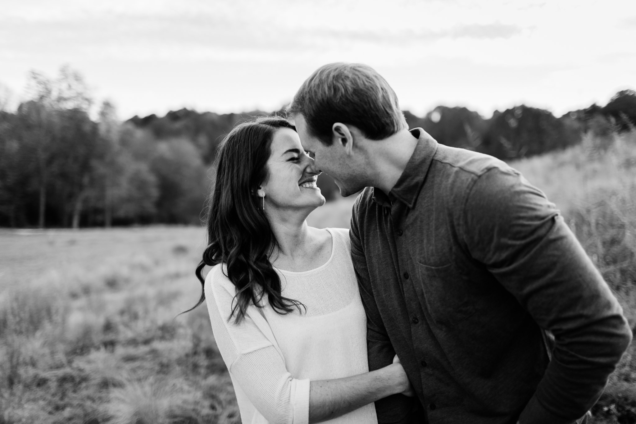 Black and white photo of couple kissing | Raleigh Photographer | By G. Lin Photography