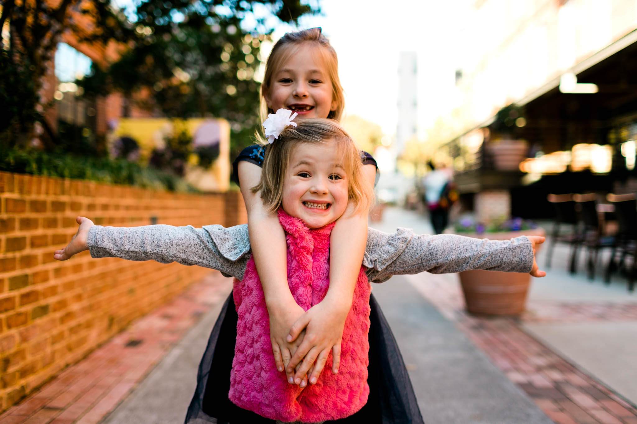 Children smiling at the American Tobacco Campus | Durham Family Photographer | By G. Lin Photography