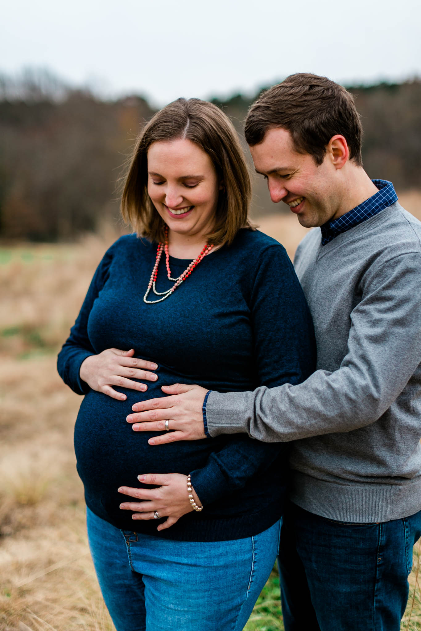 Couple with hands on baby bump | Raleigh Maternity Photographer | By G. Lin Photography