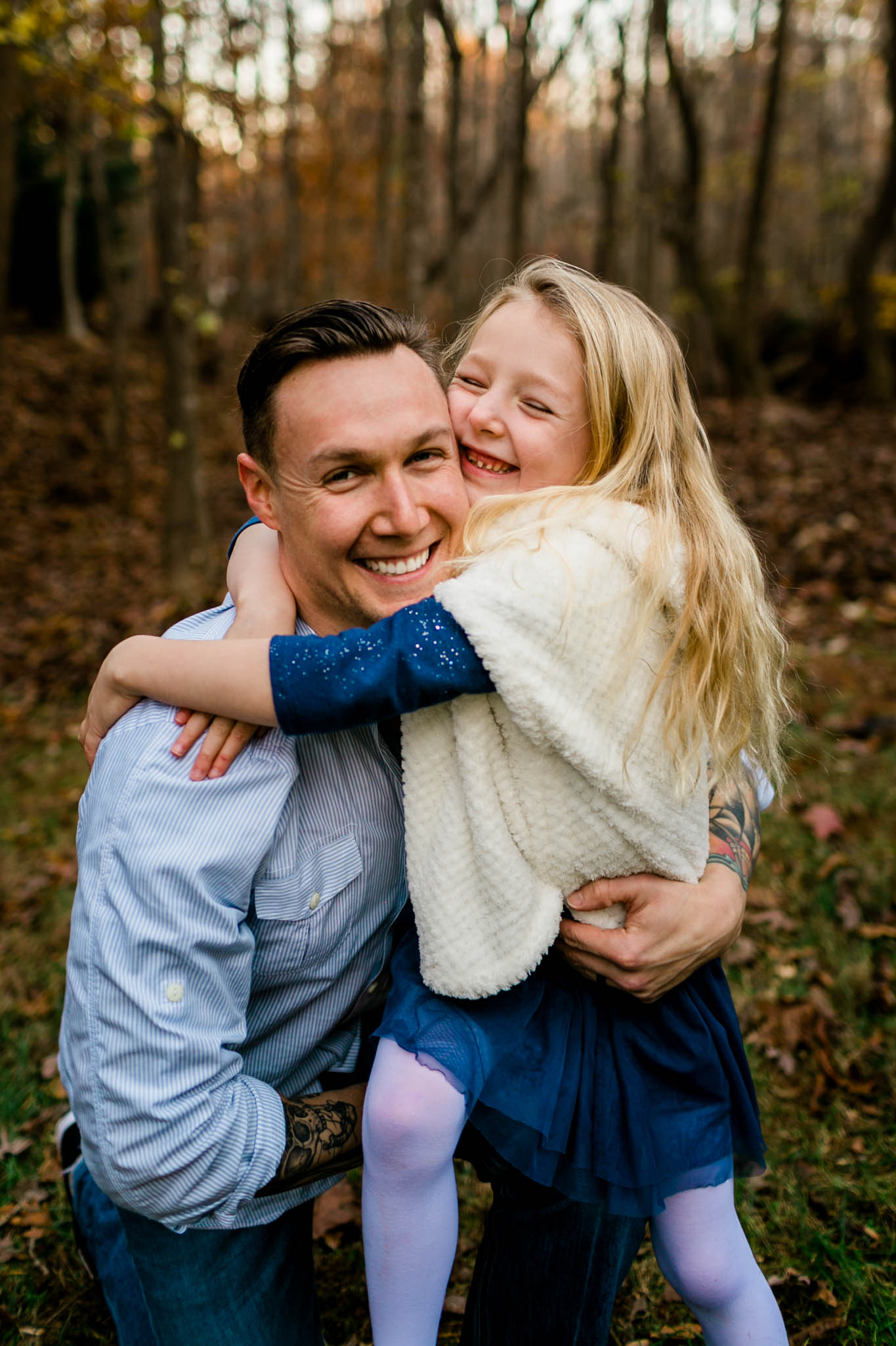 Little girl smiling and hugging dad | By G. Lin Photography | Durham Family Photographer