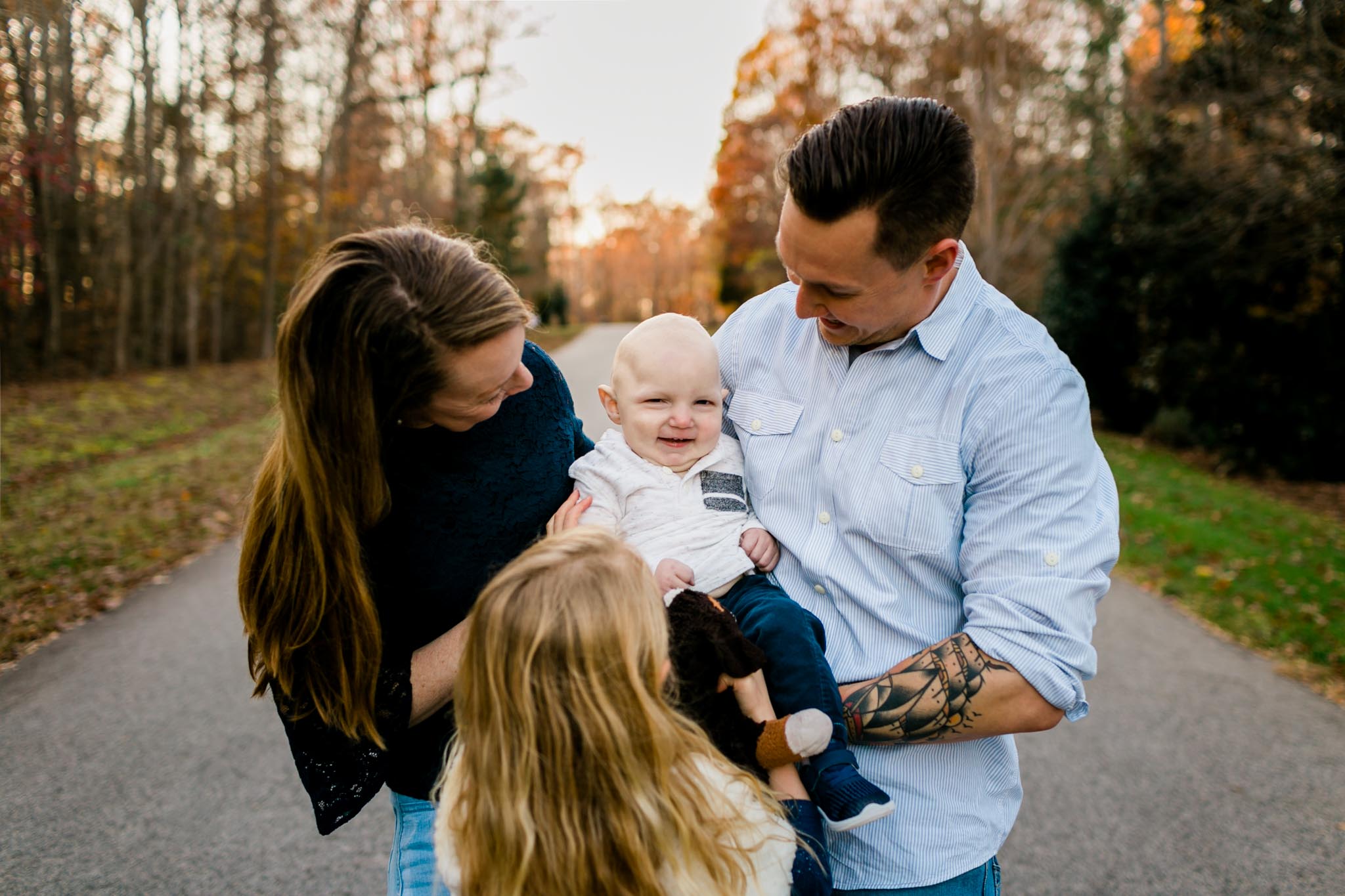 Candid family photo outside | By G. Lin Photography | Raleigh Photographer