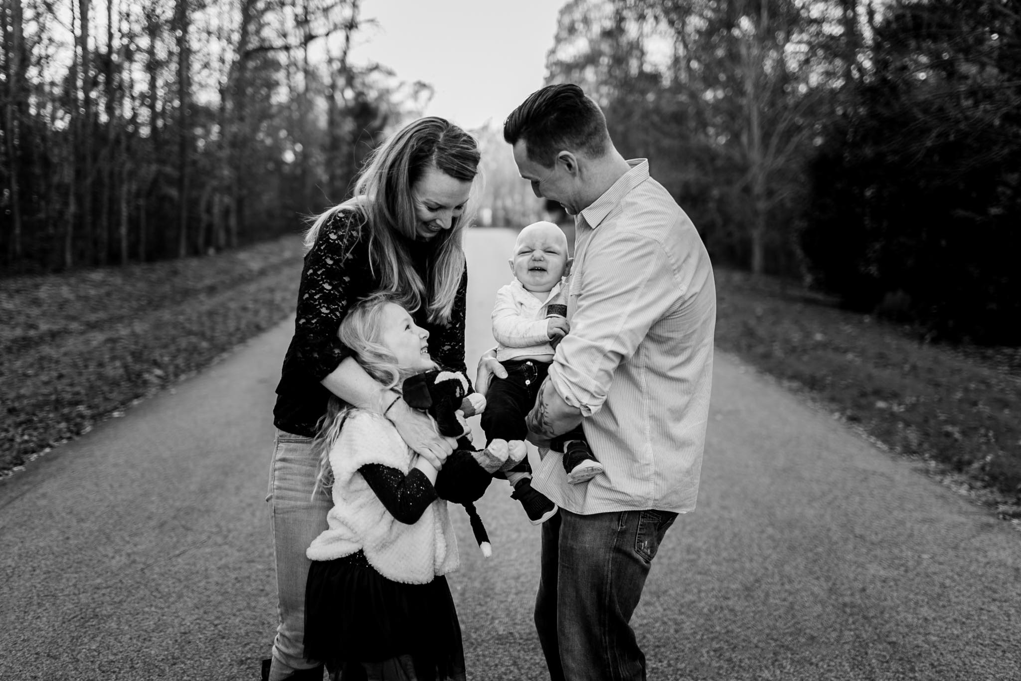 Candid black and white family photo | By G. Lin Photography | Raleigh Photographer