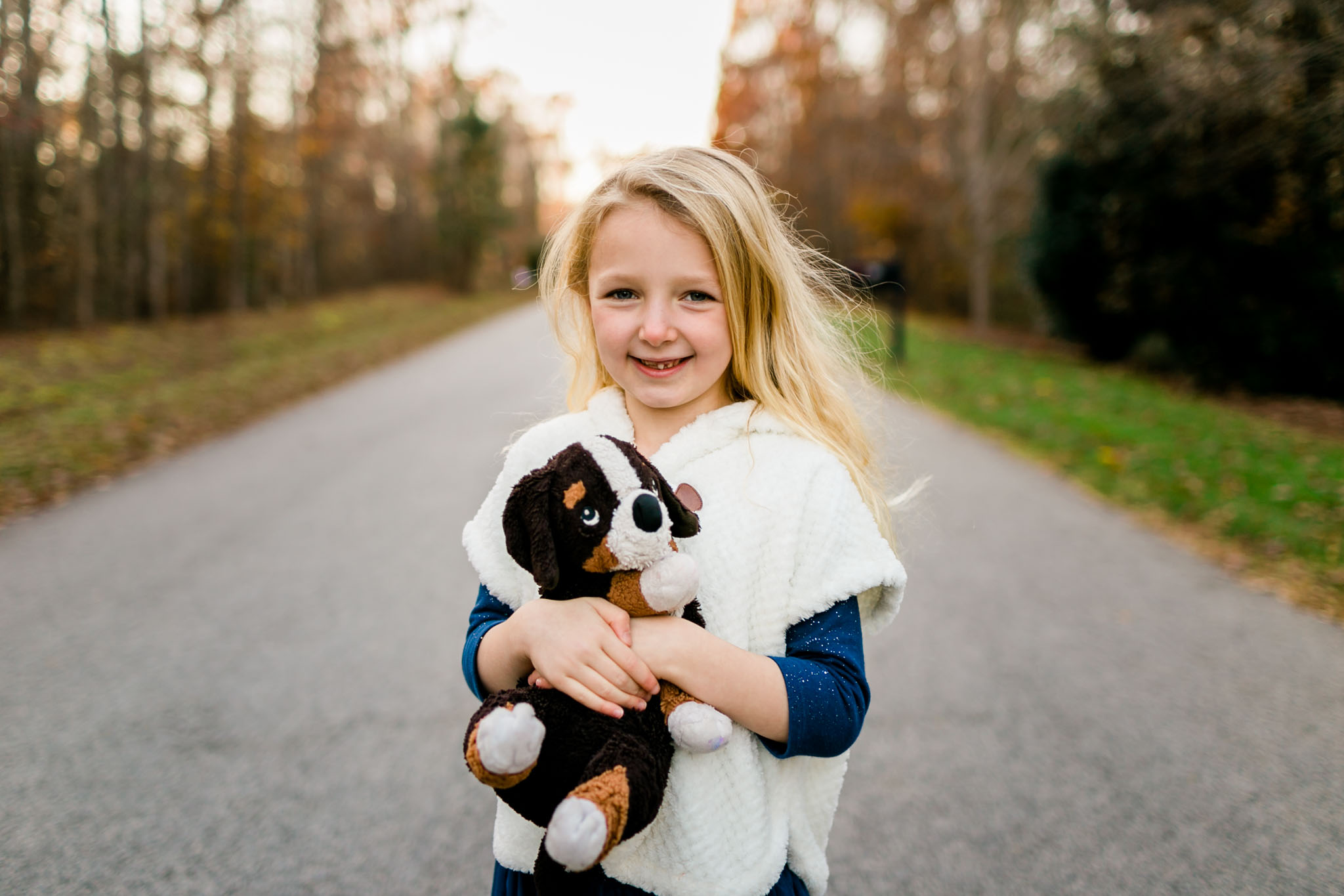 Outdoor portrait of little girl smiling | By G. Lin Photography | Raleigh Family Photographer