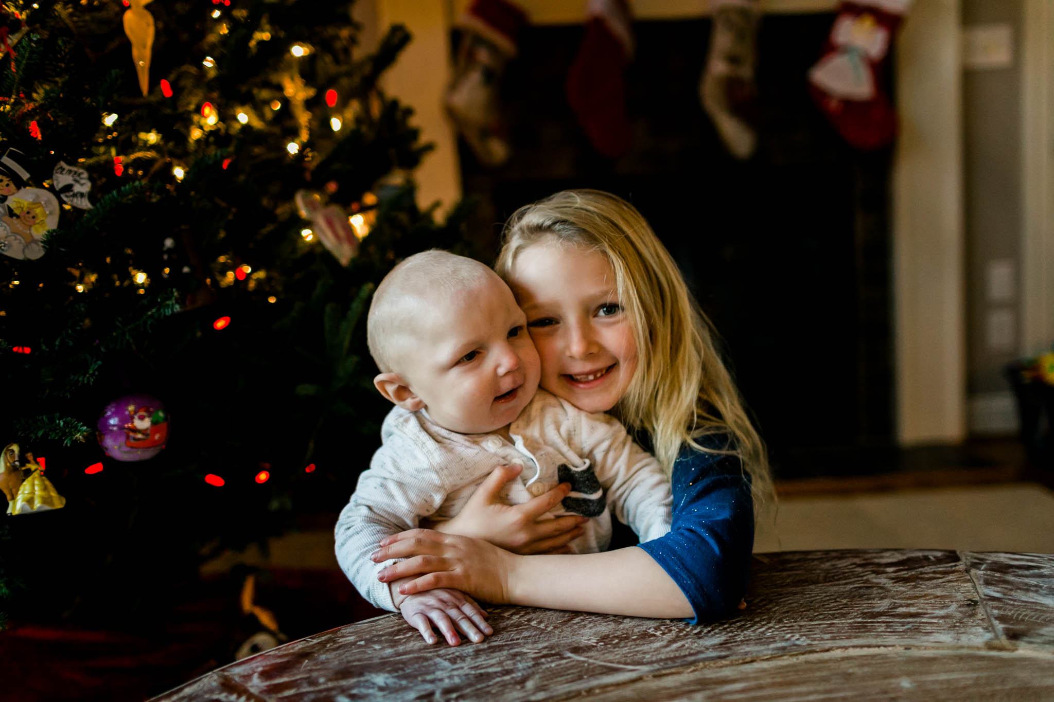 Sibling photo by Christmas tree | By G. Lin Photography | Durham Family Photographer