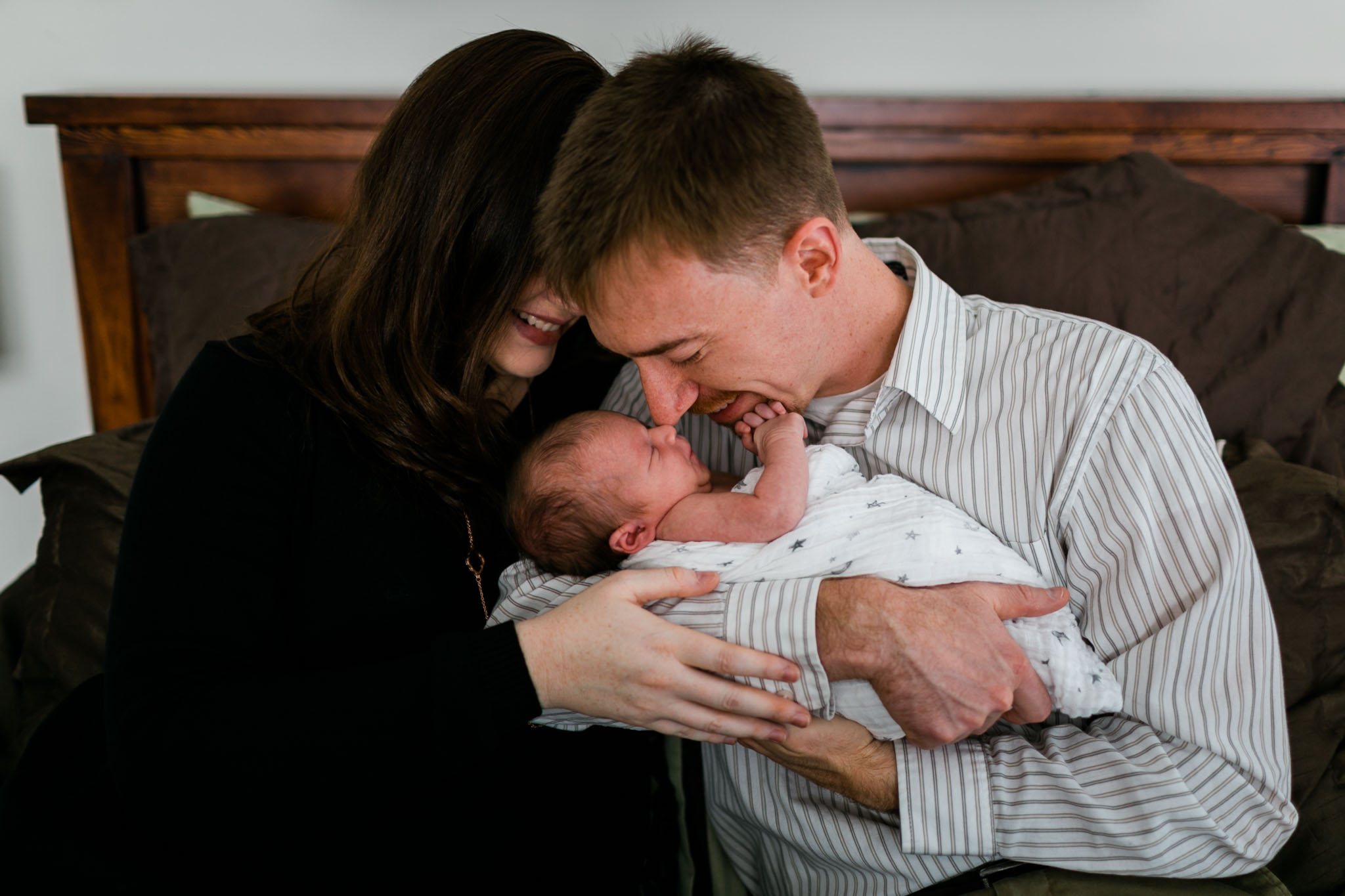 Father kissing baby on head | Durham Newborn Photographer | By G. Lin Photography