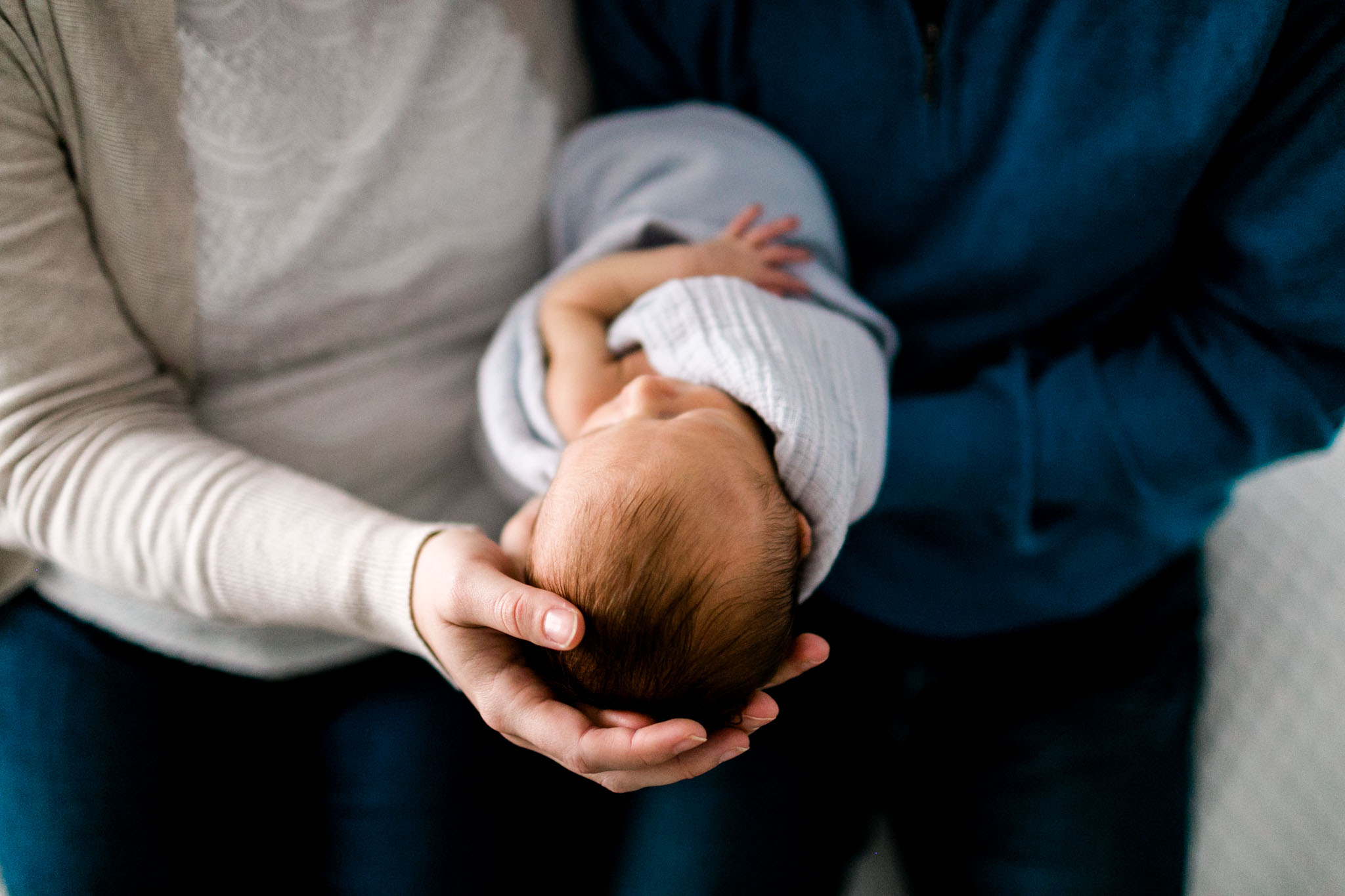 Raleigh Newborn Photographer | By G. Lin Photography | Close up of parents holding baby in hands