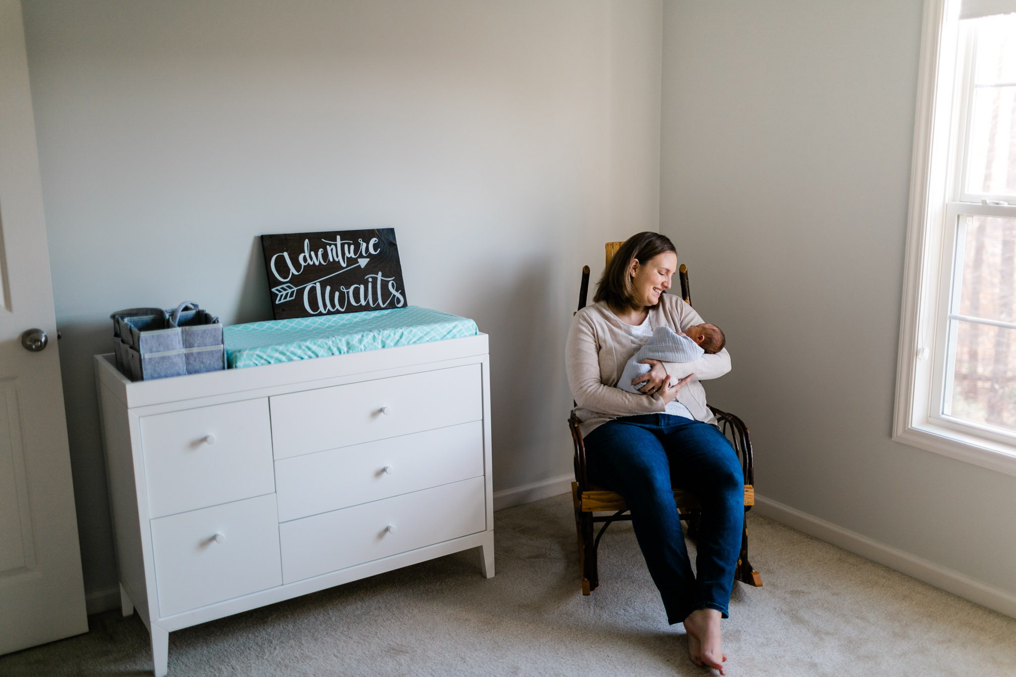 Raleigh Newborn Photographer | By G. Lin Photography | Mother rocking baby to sleep