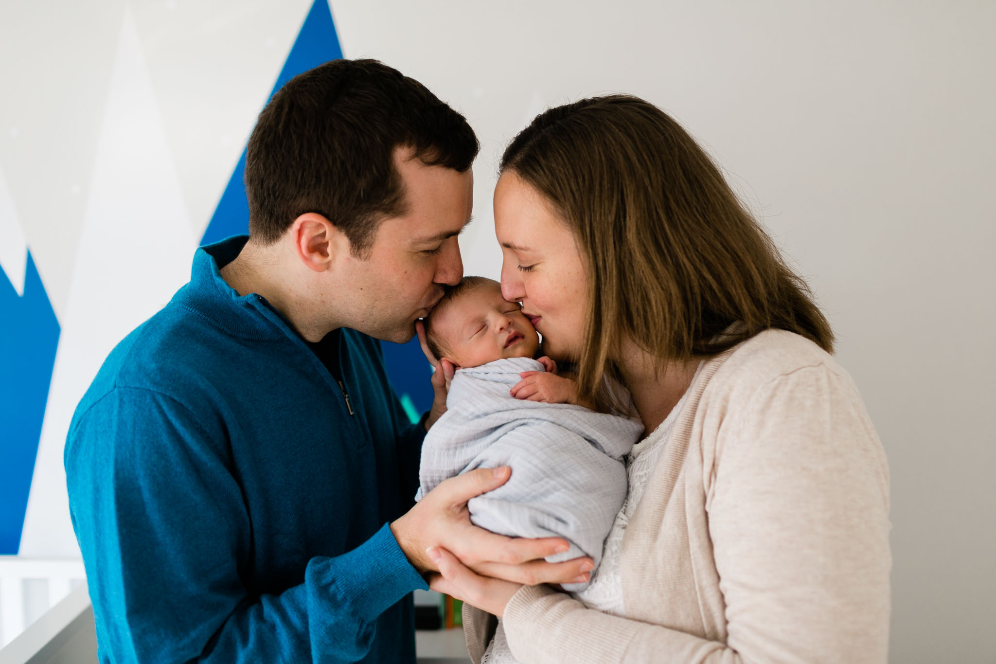 Parents kissing baby on face | Newborn Photographer in Raleigh NC | By G. Lin Photography