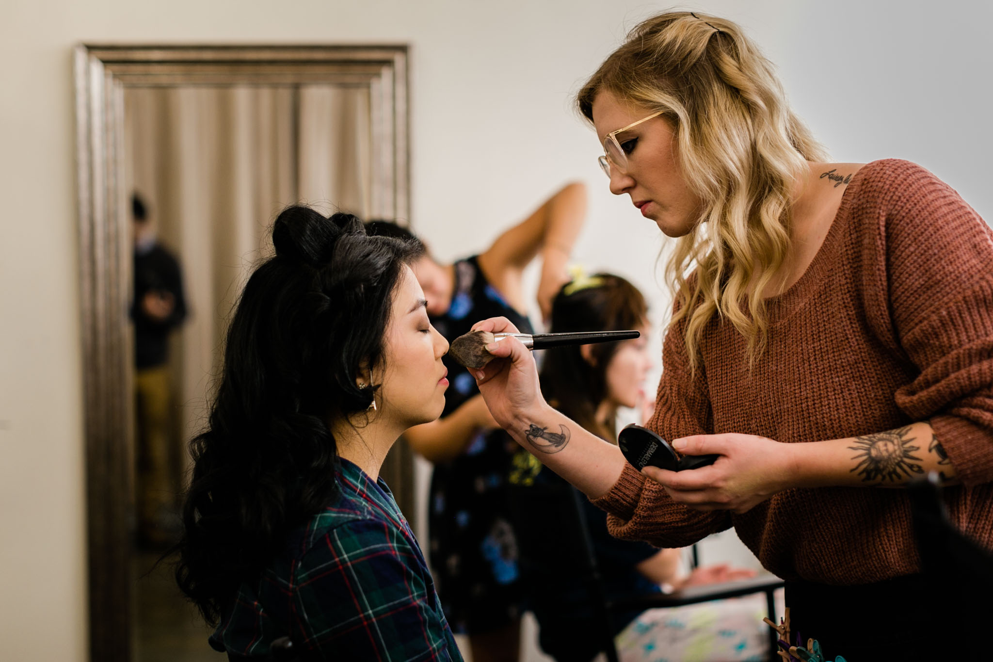 Bride getting makeup done at The Cotton Room | Durham Wedding Photographer | By G. Lin Photography