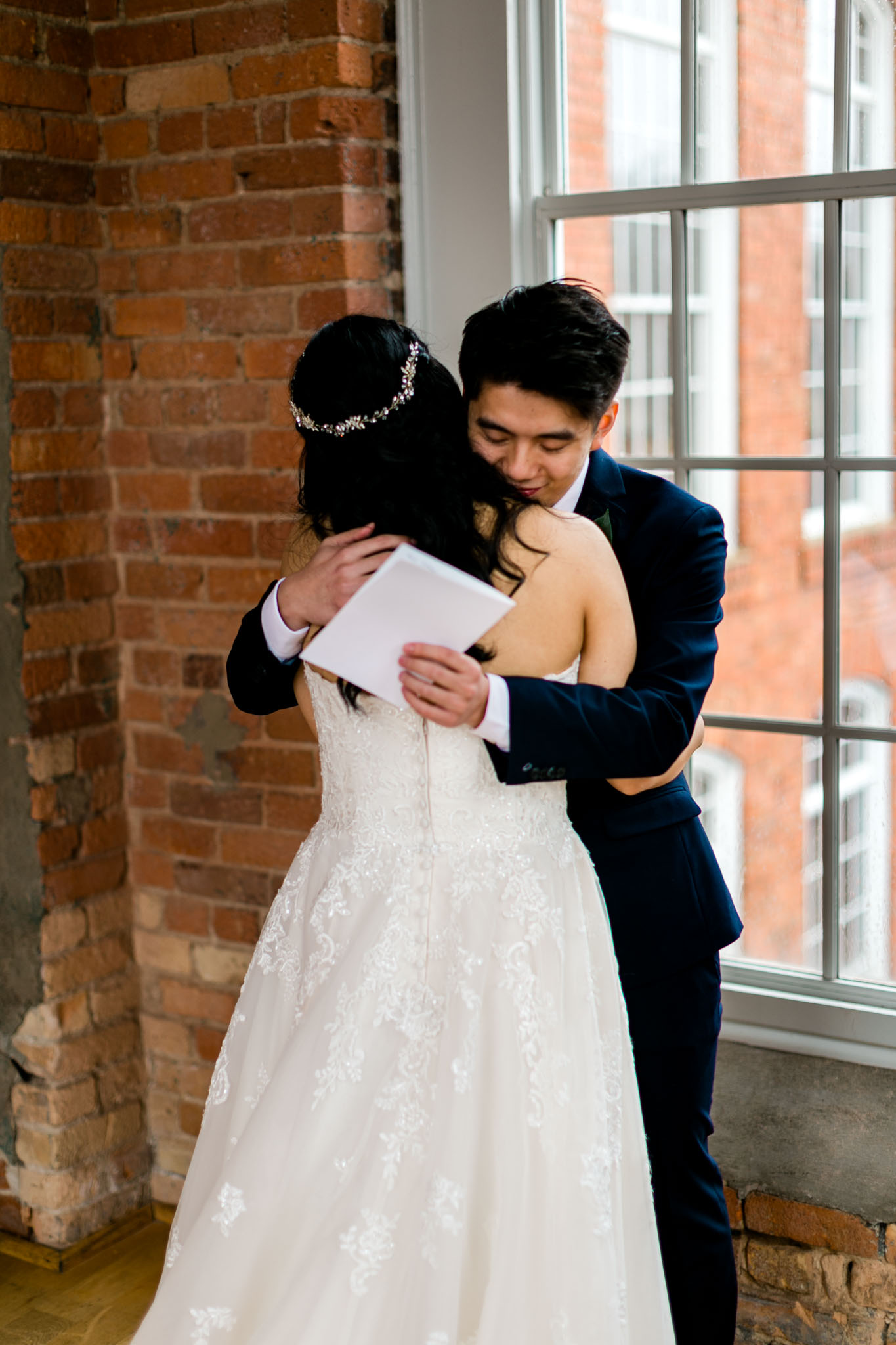 Groom hugging bride | Durham Wedding Photographer | The Cotton Room | By G. Lin Photography