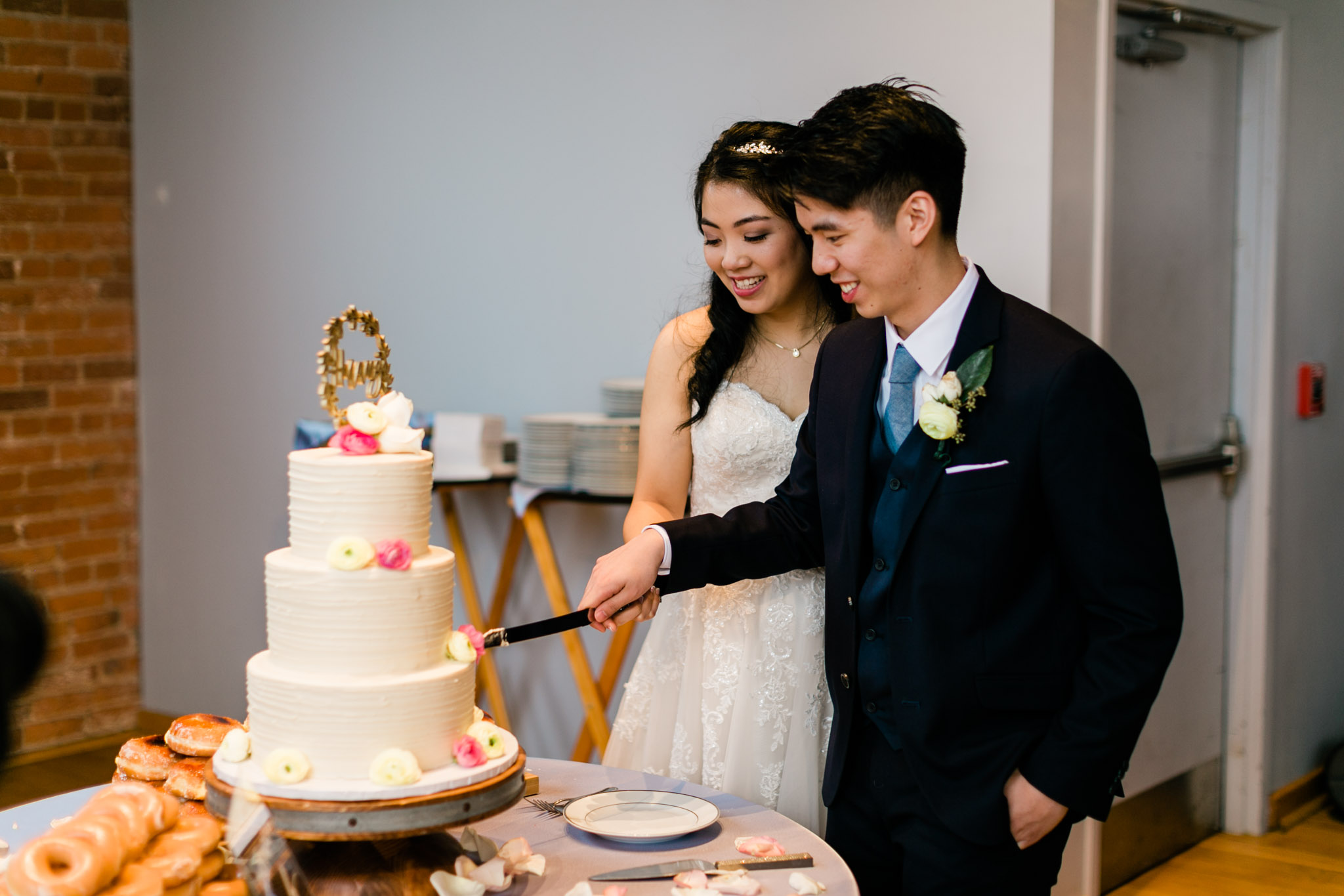 Bride and groom cutting the cake | Durham Wedding Photography | The Cotton Room | By G. Lin Photography