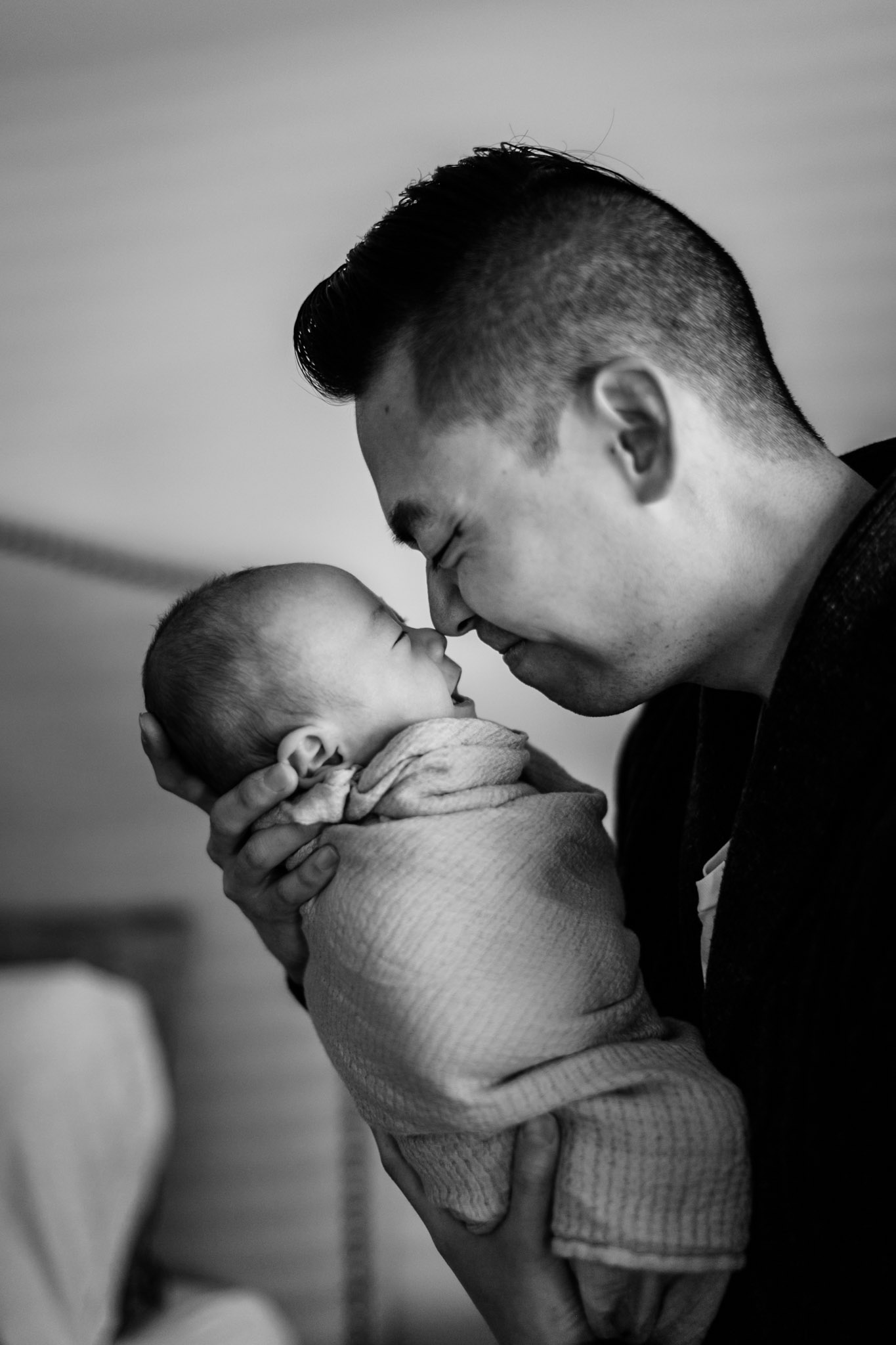 Black and white photo of father and son | Newborn Photographer in Durham NC | By G. Lin Photography