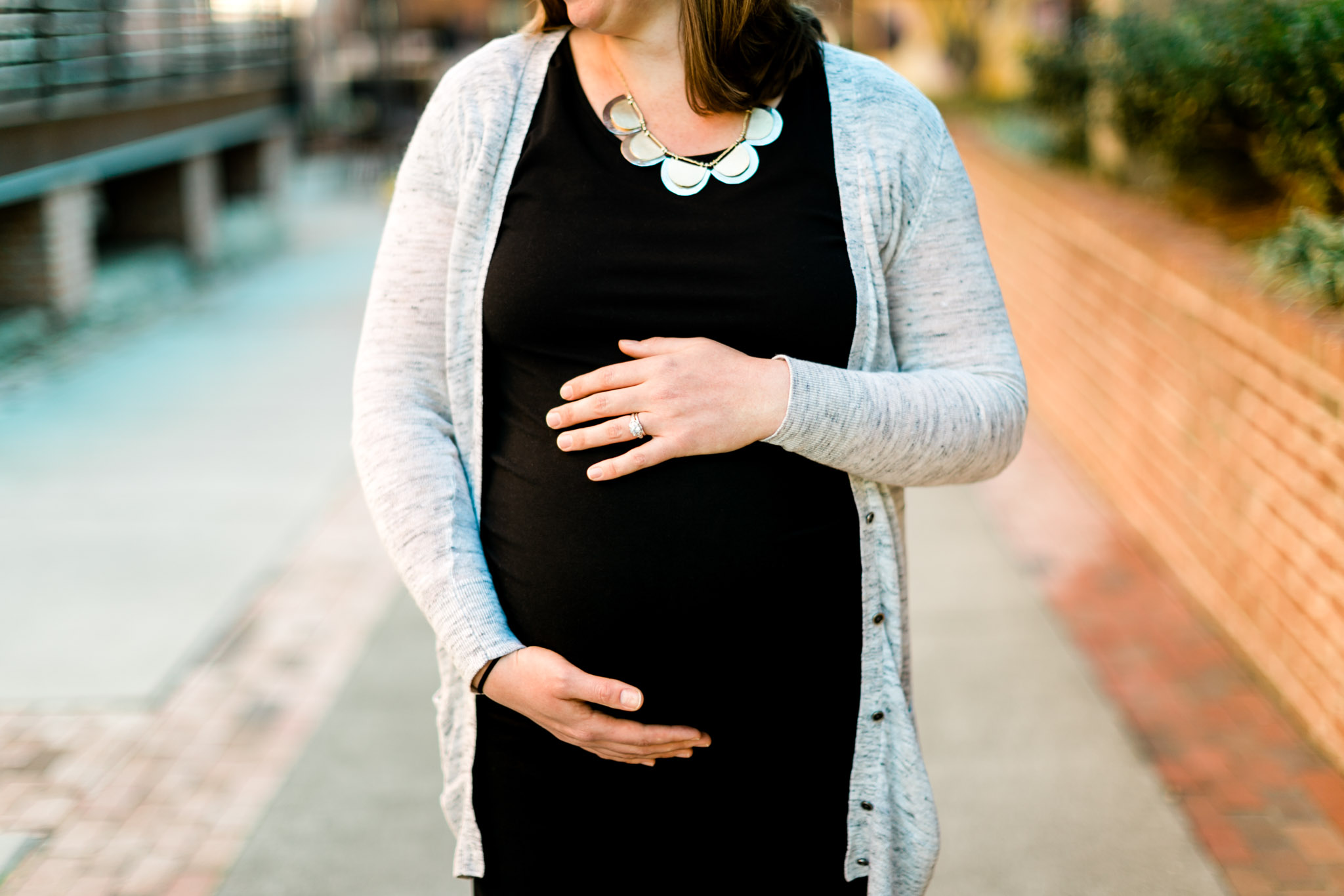 Close up portrait of mom holding baby belly | Raleigh Maternity Photographer | By G. Lin Photography