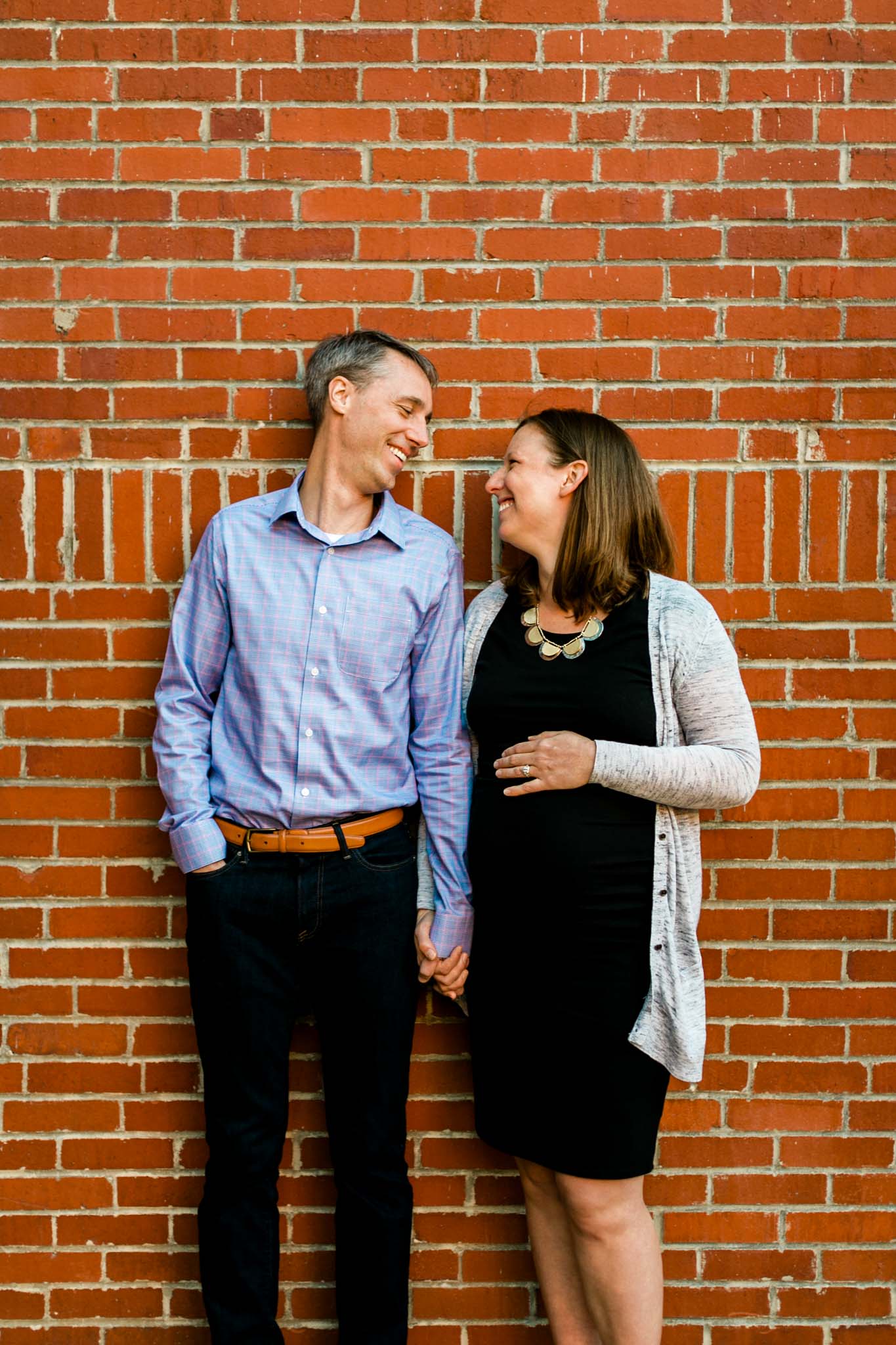 Candid photo of couple at American Tobacco Campus | Durham Newborn Photographer | By G. Lin Photography