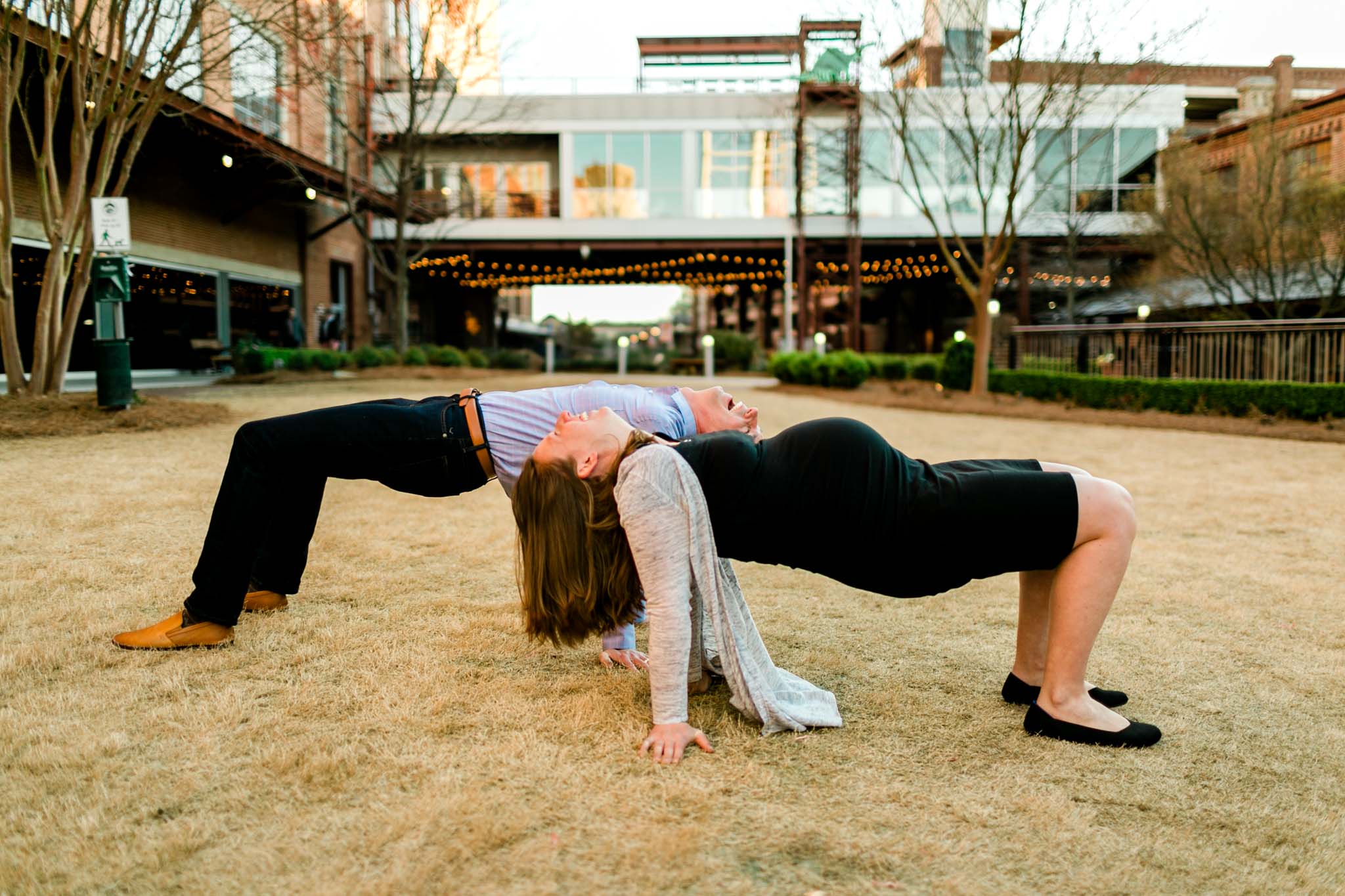 Couple doing a yoga pose at American Tobacco Campus | Durham Family Photographer | By G. Lin Photography