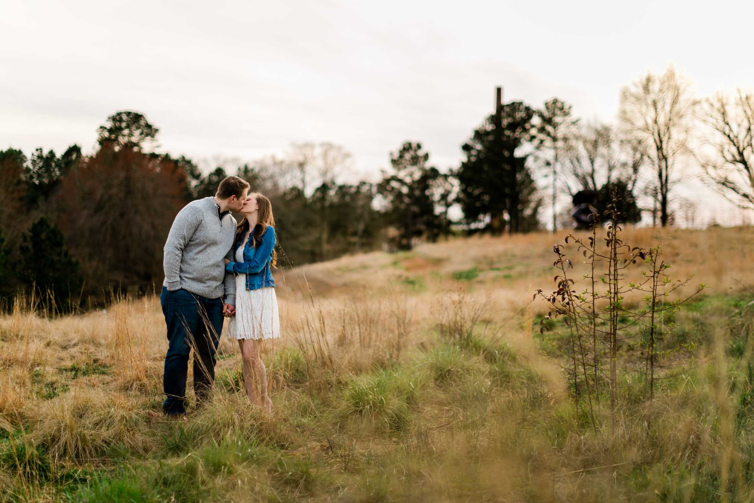 Couple kissing in open field | Durham Wedding Photographer | By G. Lin Photography