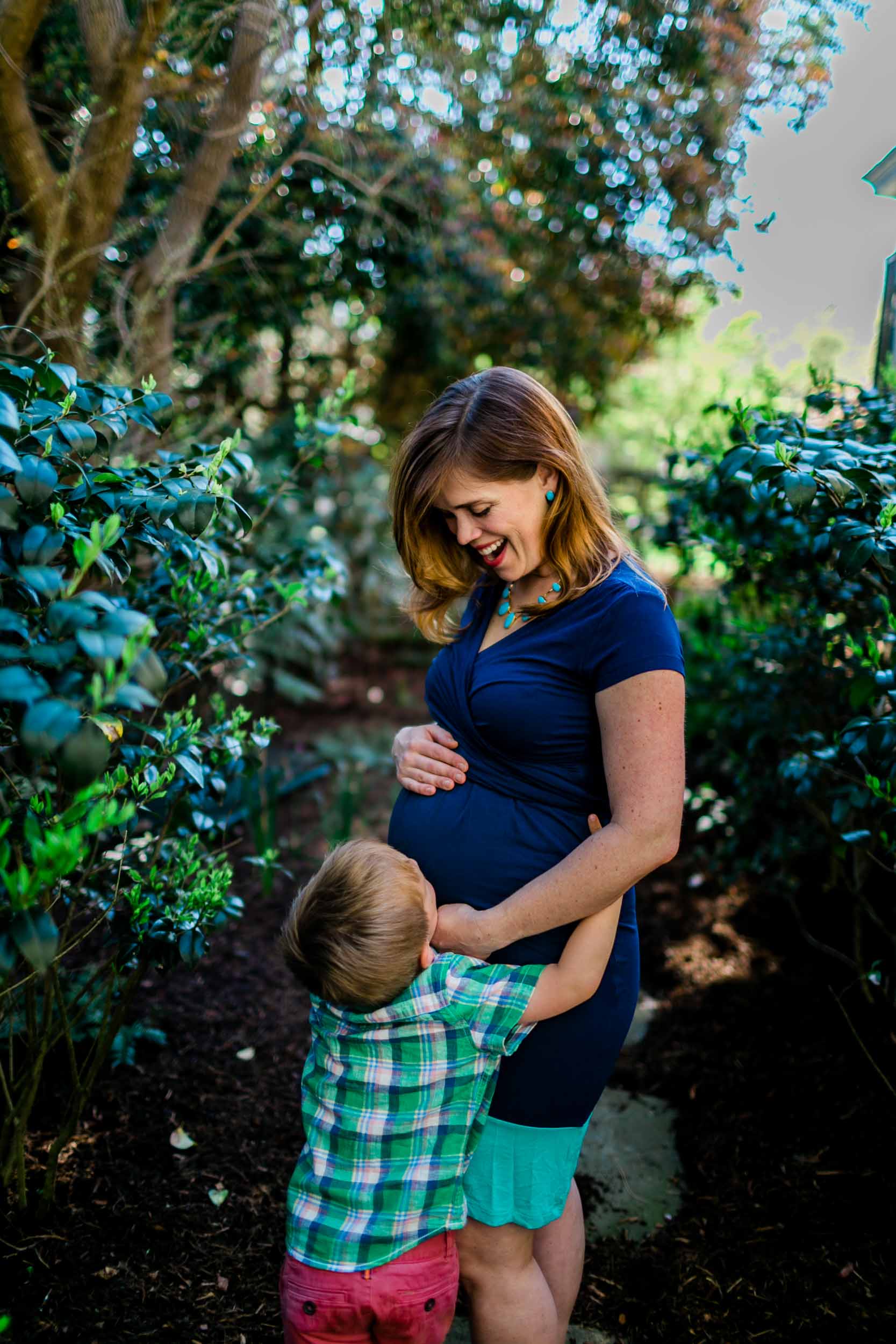 Durham Maternity Photographer | By G. Lin Photography | Son hugging mother's baby belly