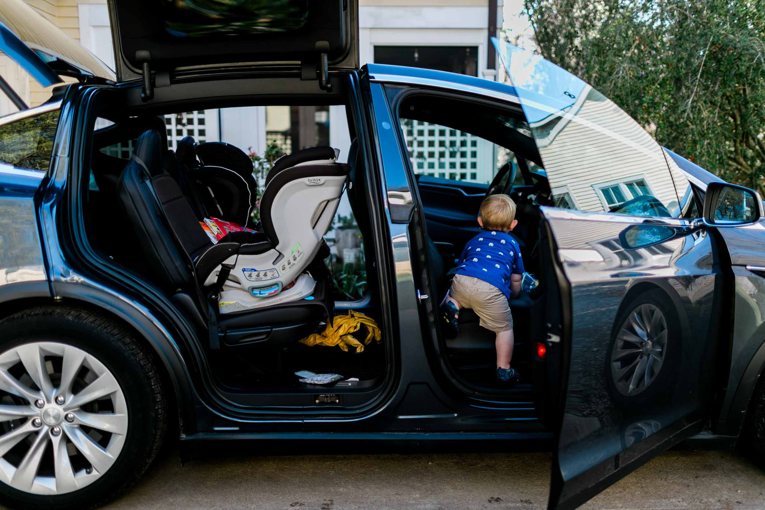 Boy climbing into car | Durham Photographer | By G. Lin Photography