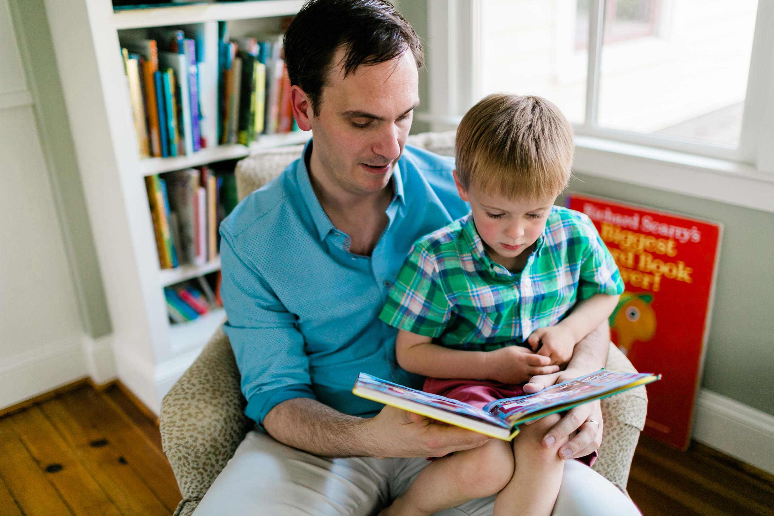 Father reading book to son | Raleigh Family Photographer | By G. Lin Photography