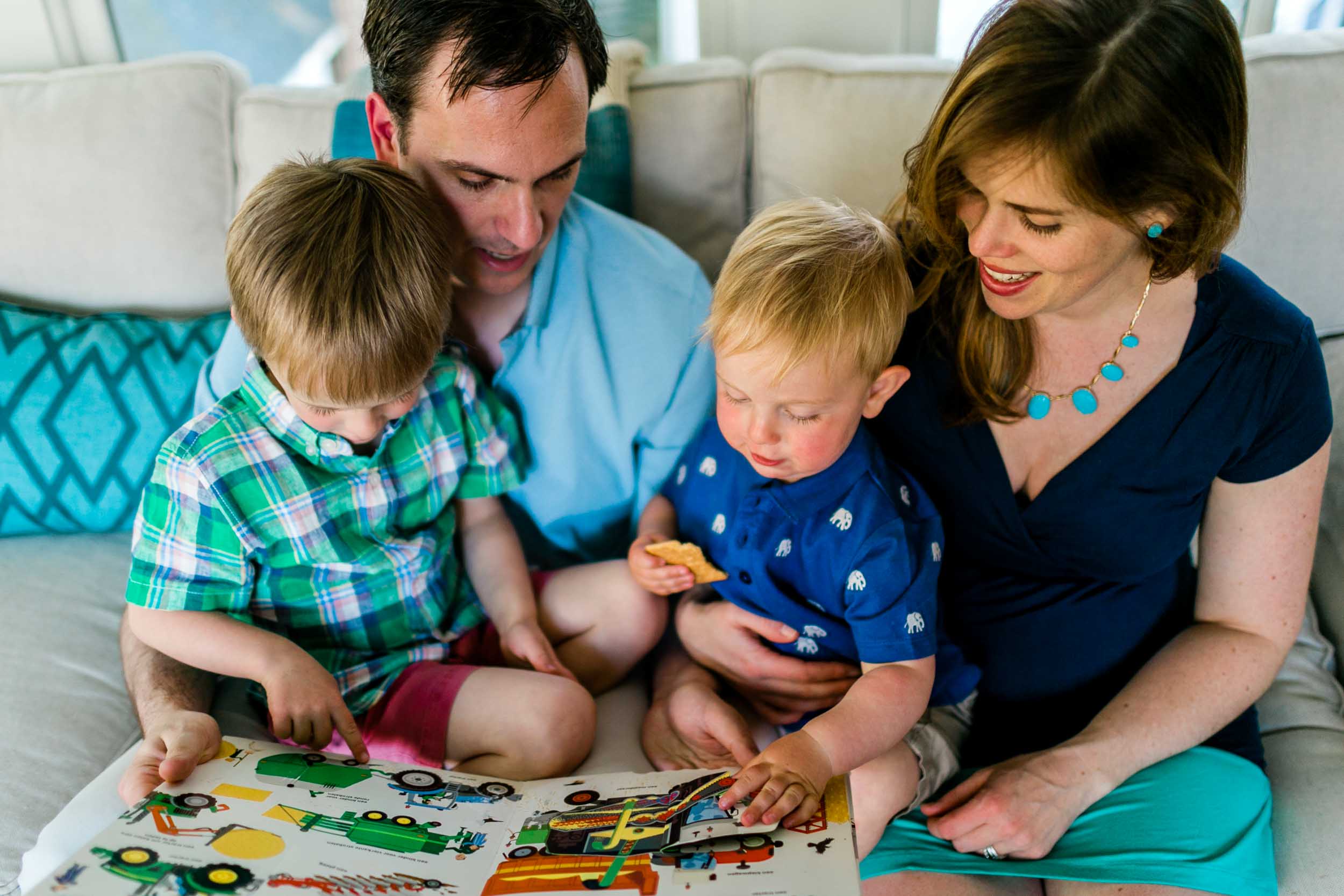 Family reading together on couch | Raleigh Family Photographer | By G. Lin Photography