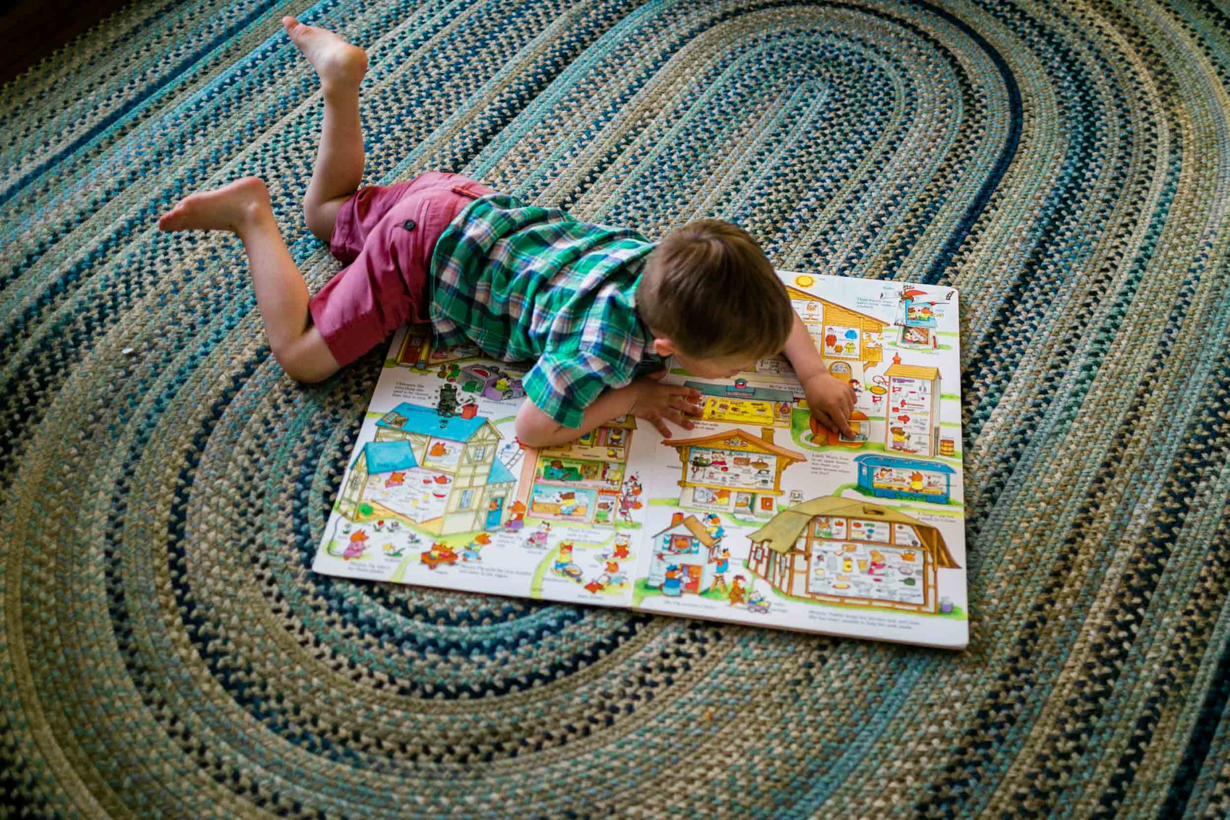 Boy reading book on floor | Durham Photographer | By G. Lin Photography