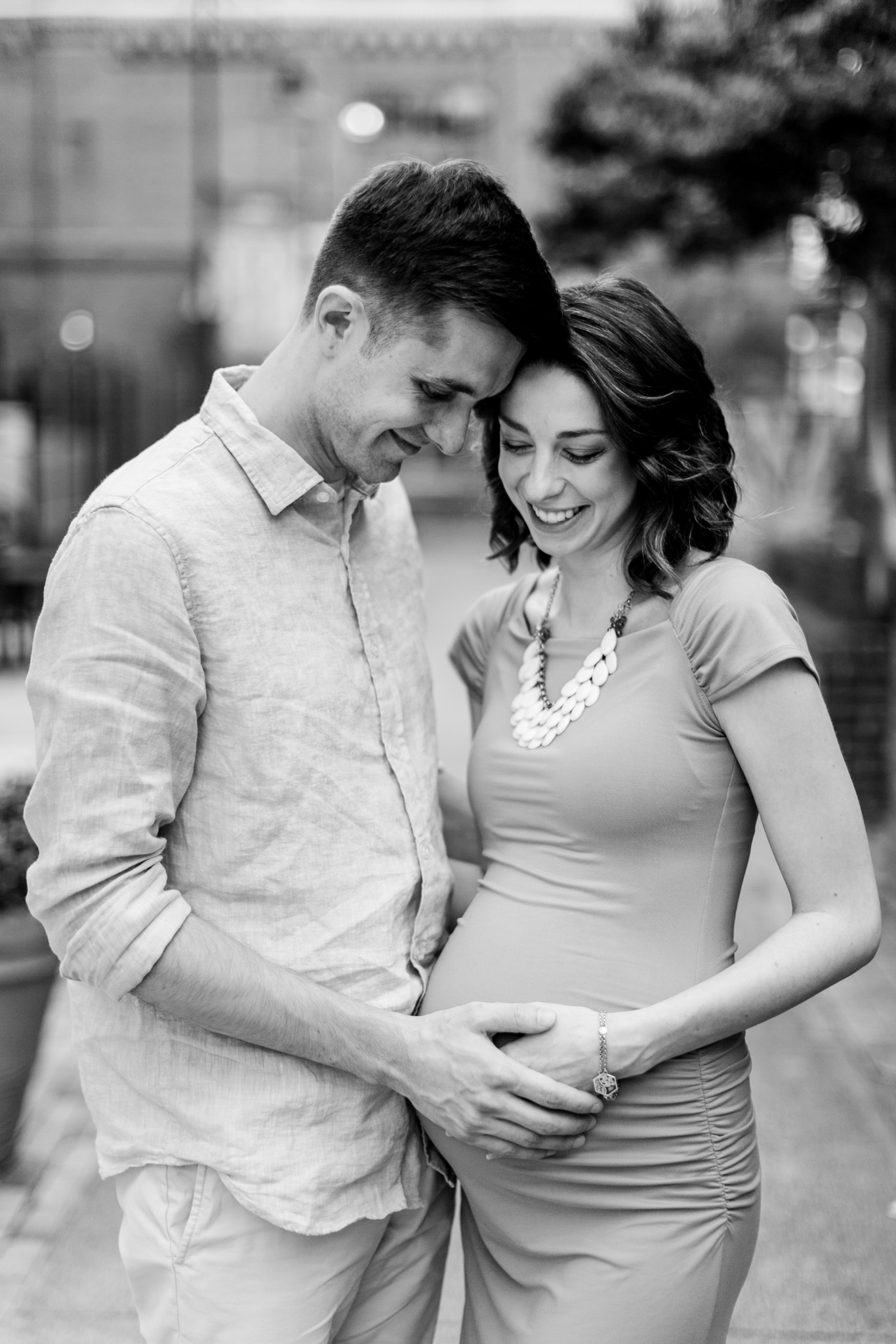 Beautiful black and white maternity photo of couple holding hands on belly | Durham Newborn Photographer | By G. Lin Photography