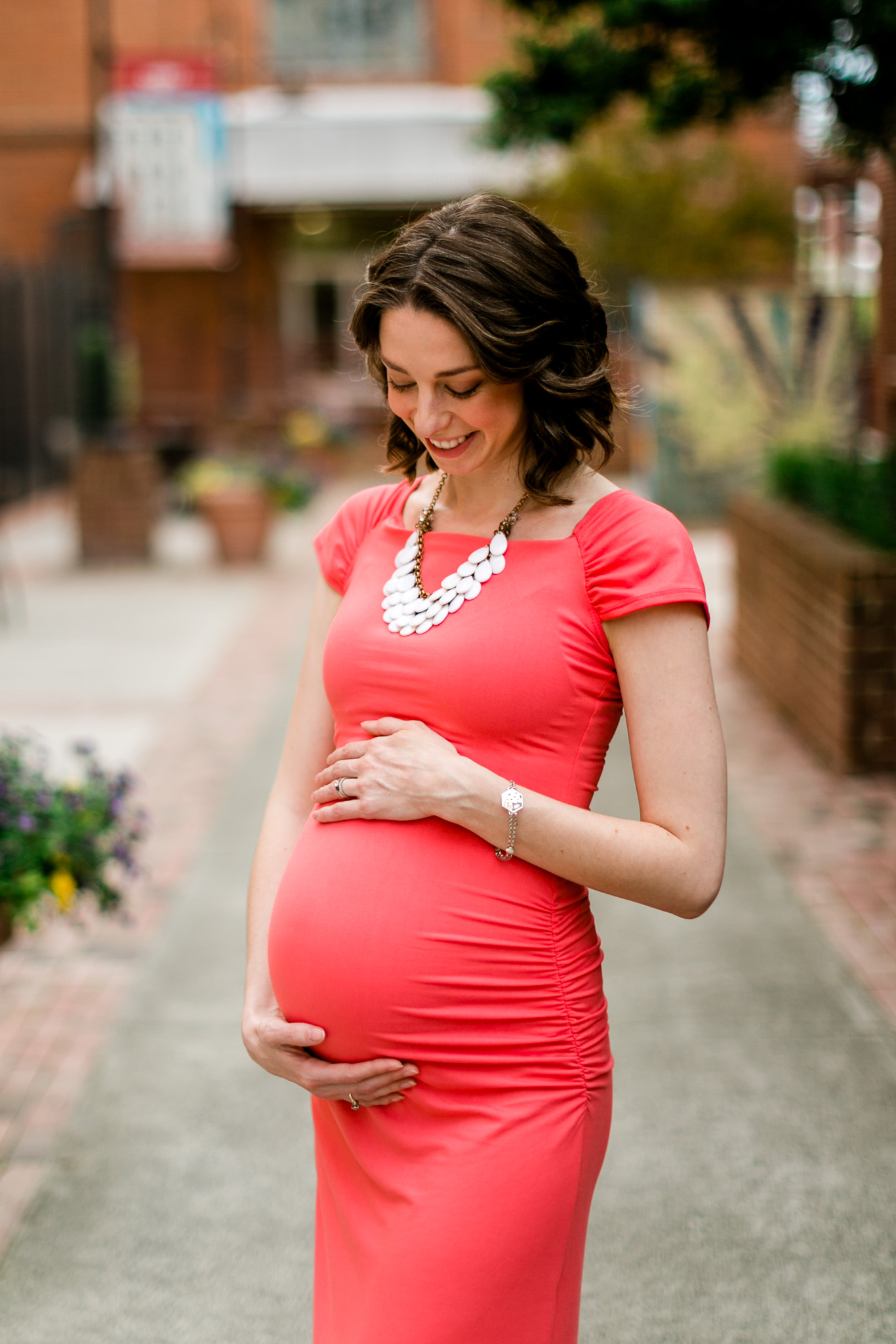 Woman holding hands on baby bump | Durham Family Photographer | By G. Lin Photography