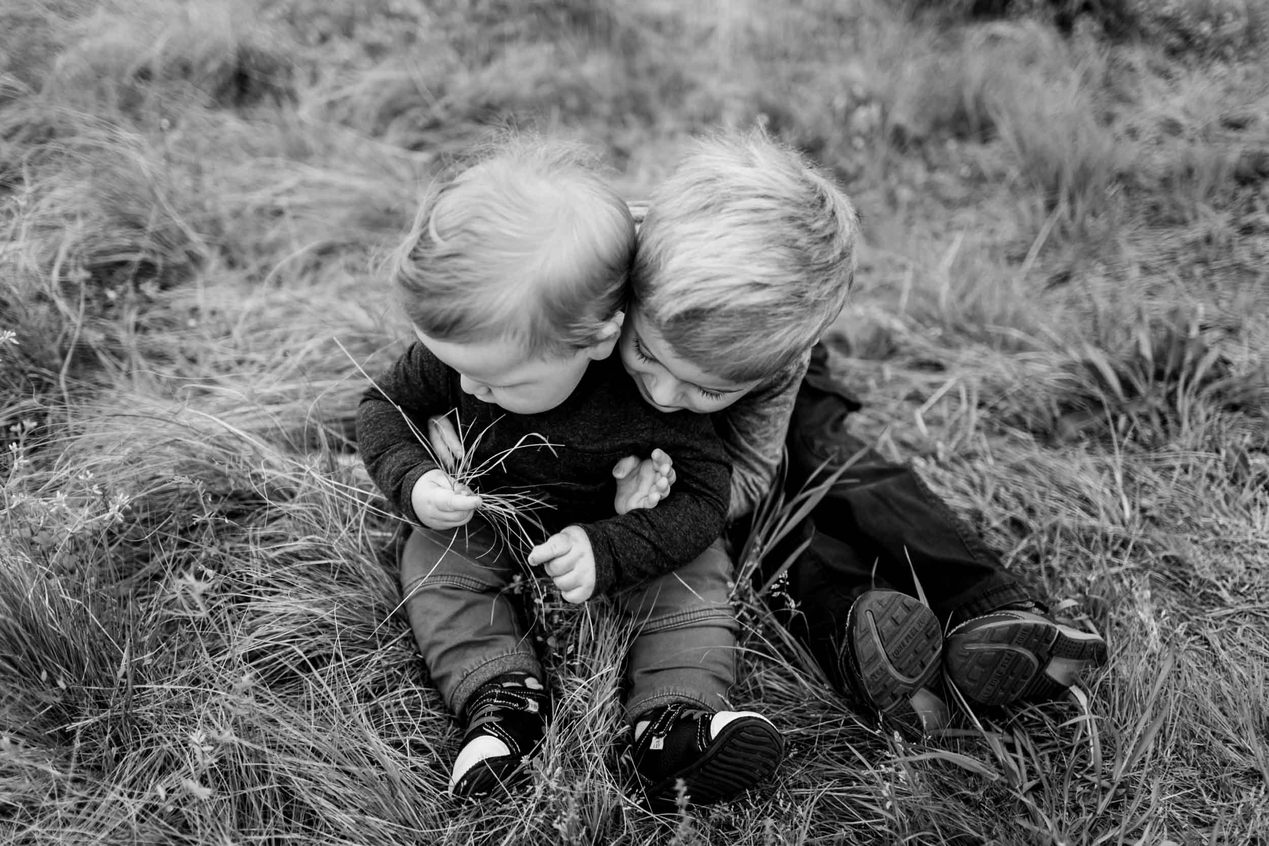 Black and white photo of brothers hugging | Raleigh Family Photographer | By G. Lin Photography