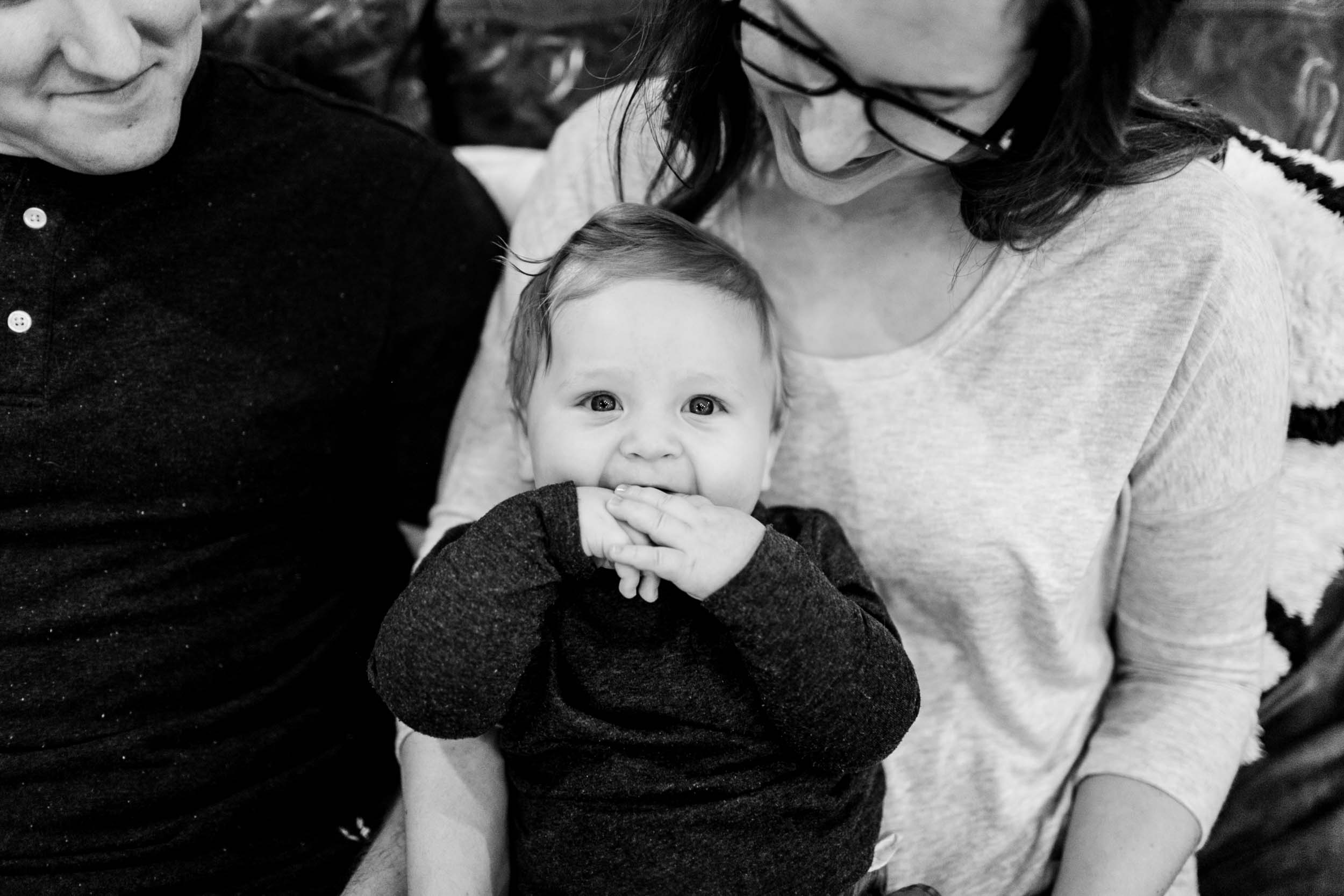 Black and white photo of young toddler sitting on mom's lap | Raleigh Family Photographer and Newborn Photography | By G. Lin Photography