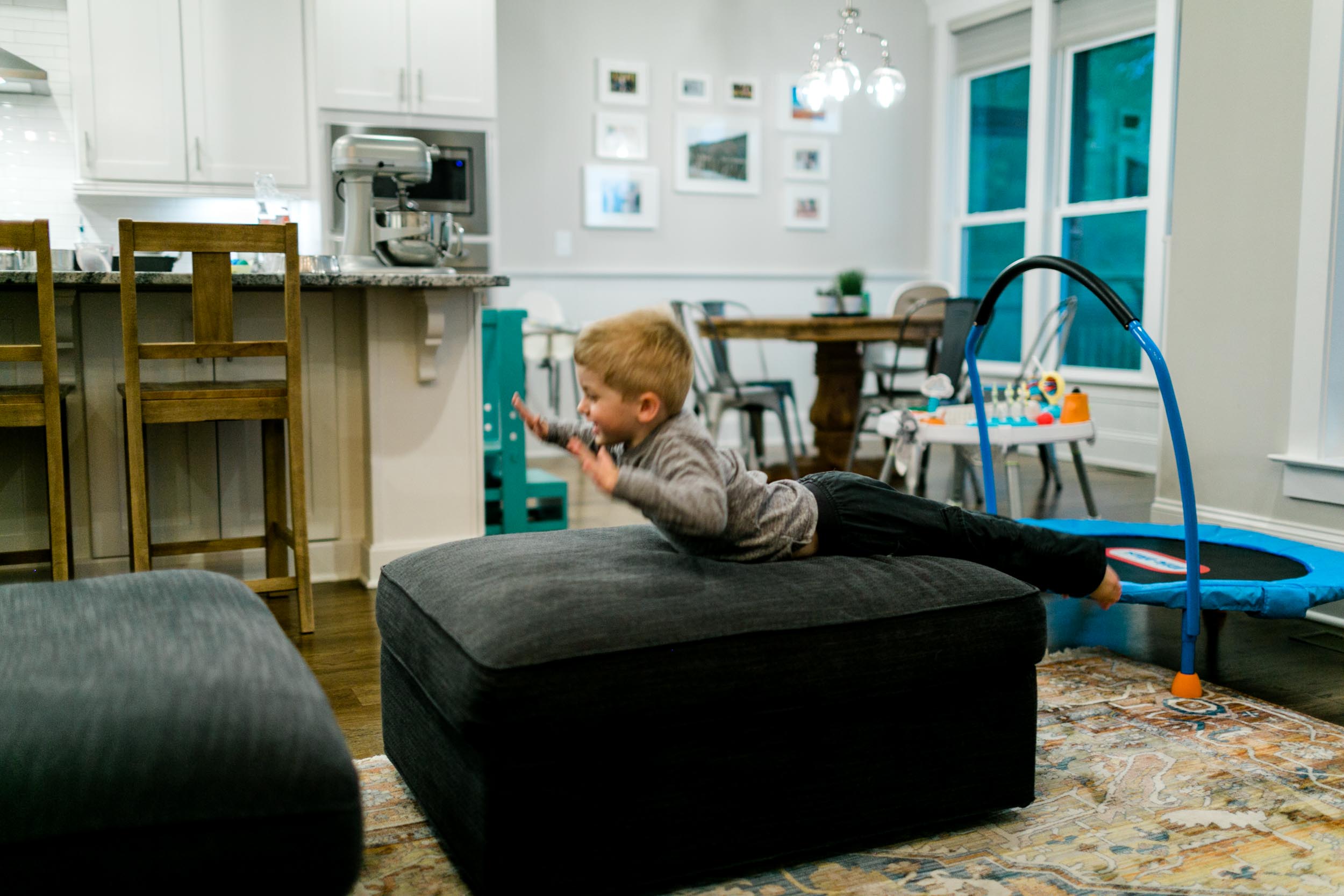 Little boy jumping on couch | Durham Photographer | Raleigh Lifestyle Family Photography | By G. Lin Photography