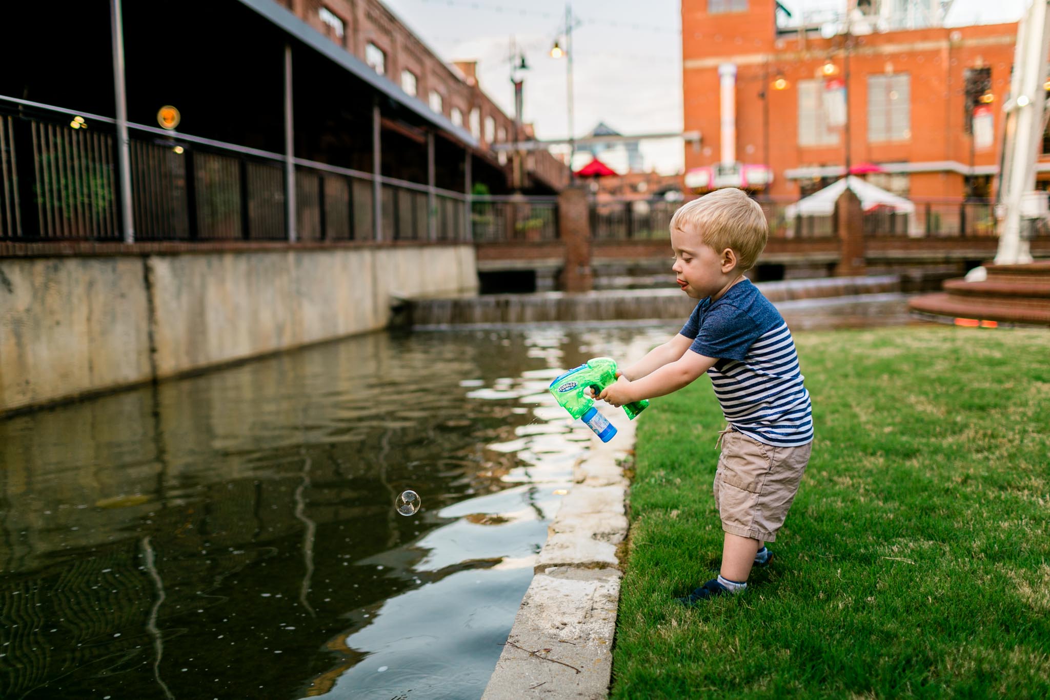 Durham Family and Children Photographer | Boy spraying bubbles | By G. Lin Photography