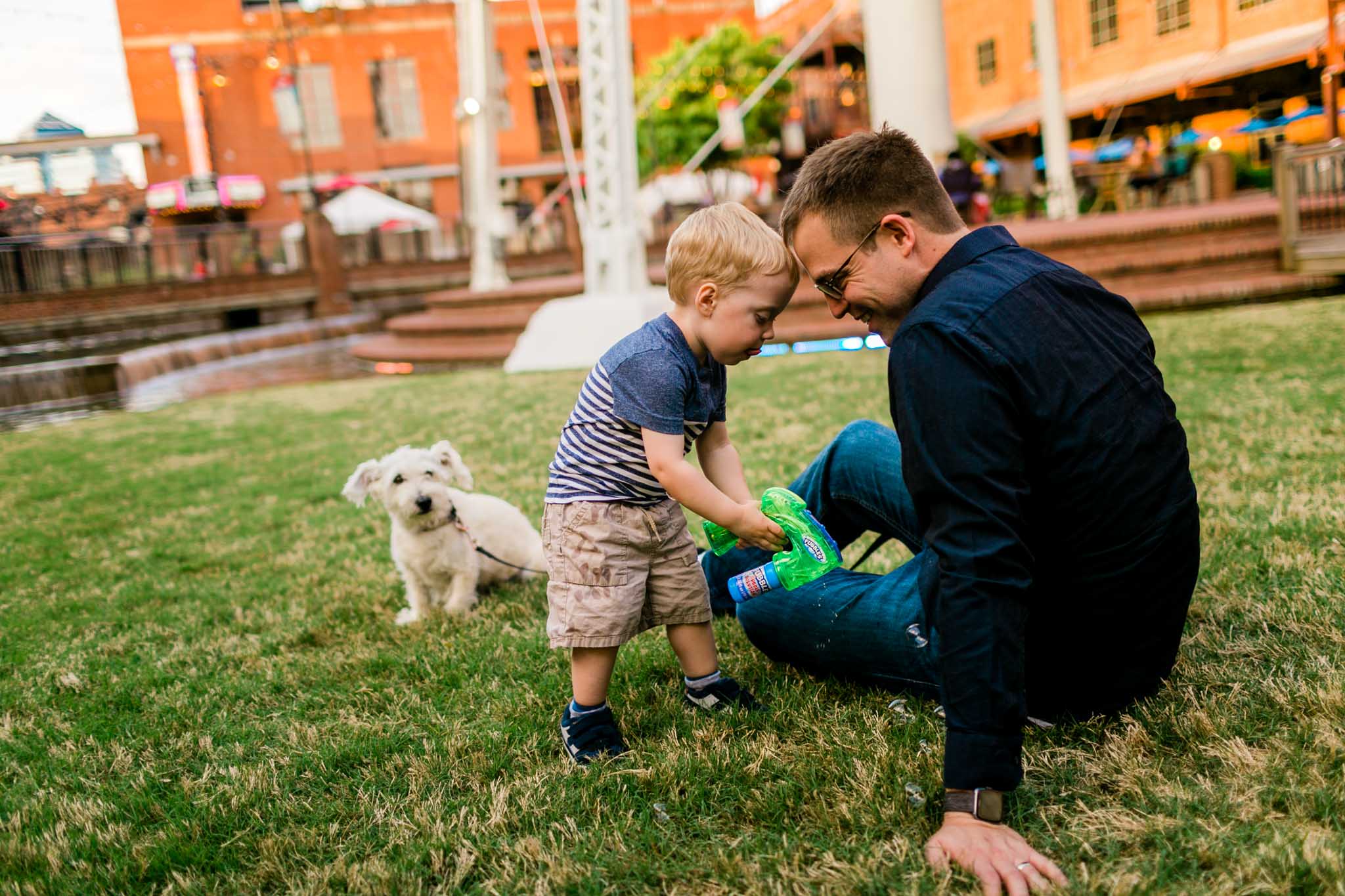 Candid photo of father and son | Durham Photographer | American Tobacco Campus | By G. Lin Photography