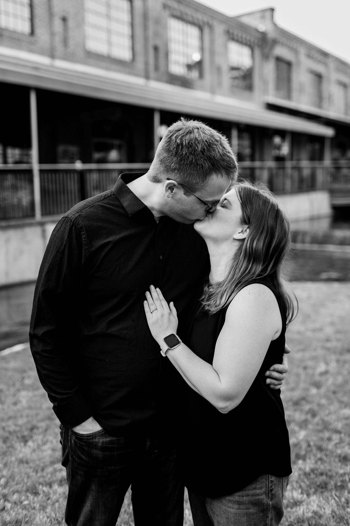 Durham Photographer | Black and white photo of couple kissing | American Tobacco Campus | By G. Lin Photography