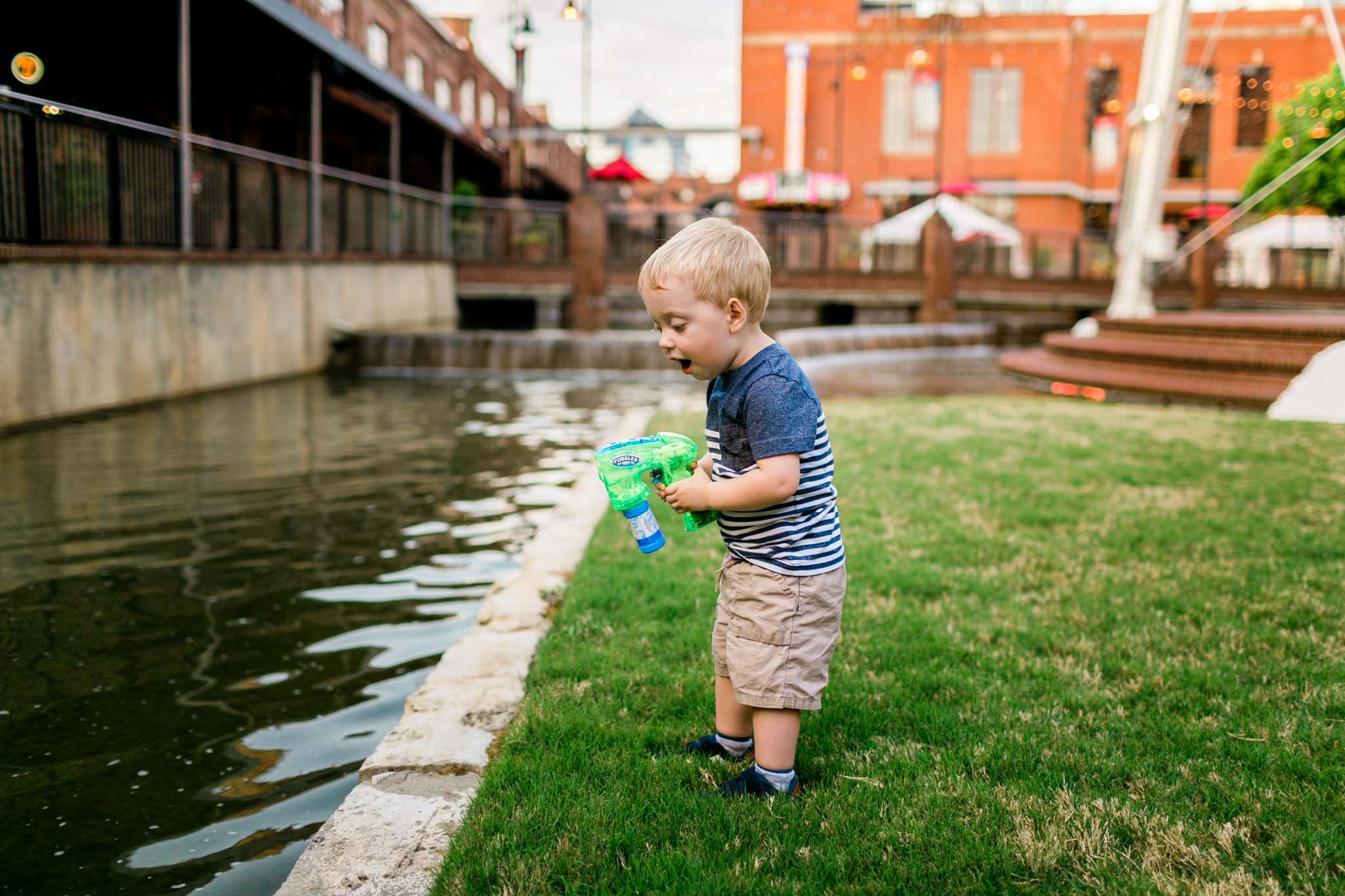 Boy playing with bubbles by water | Durham Photographer | By G. Lin Photography