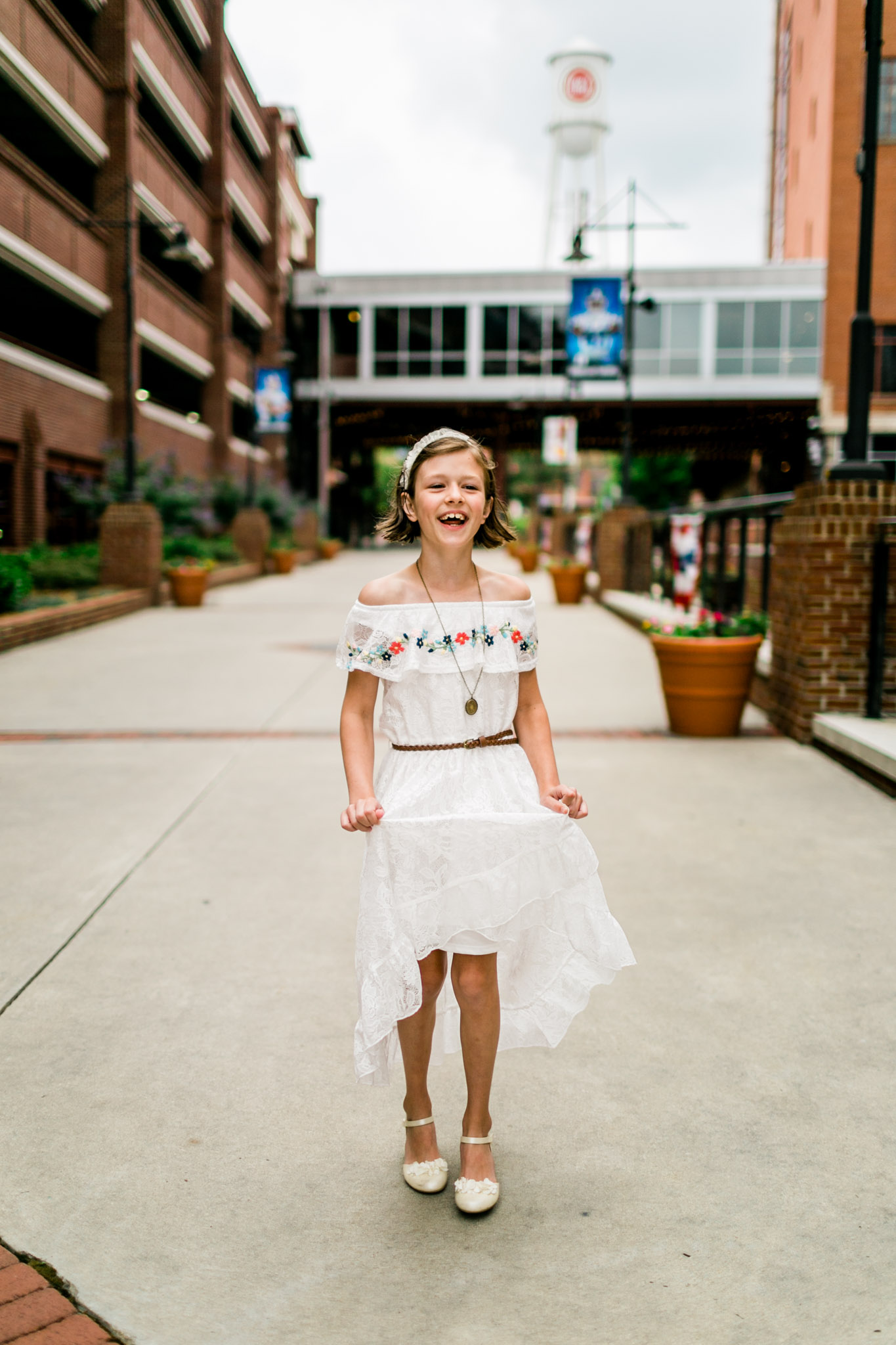 Durham Family Photographer | By G. Lin Photography | Portrait of girl twirling dress and laughing