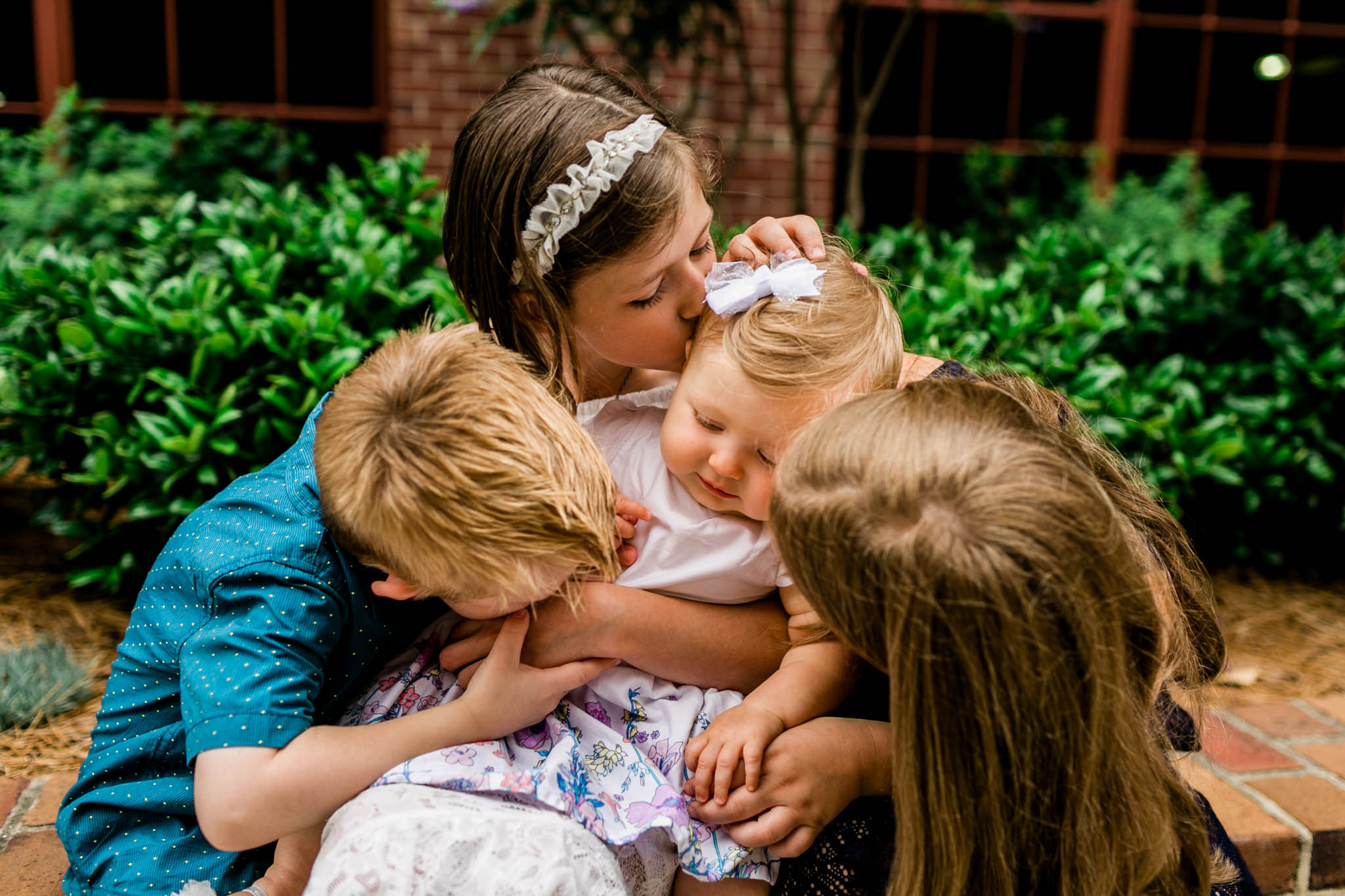 Durham Family Photographer | By G. Lin Photography | Candid sibling photo at American Tobacco Campus