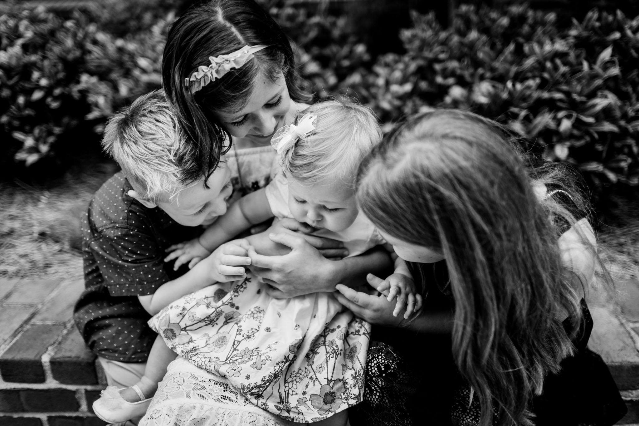 Durham Family Photographer | By G. Lin Photography | Black and white portrait of siblings holding baby sister