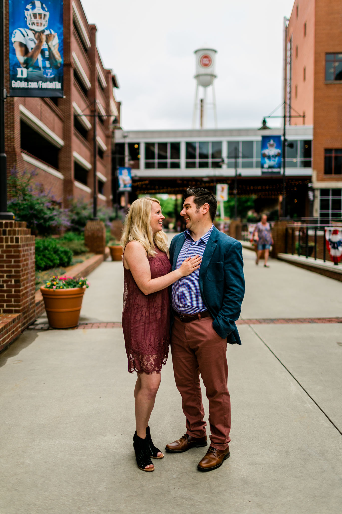 Durham Family Photographer | By G. Lin Photography | Candid portrait of couple laughing together at American Tobacco Campus